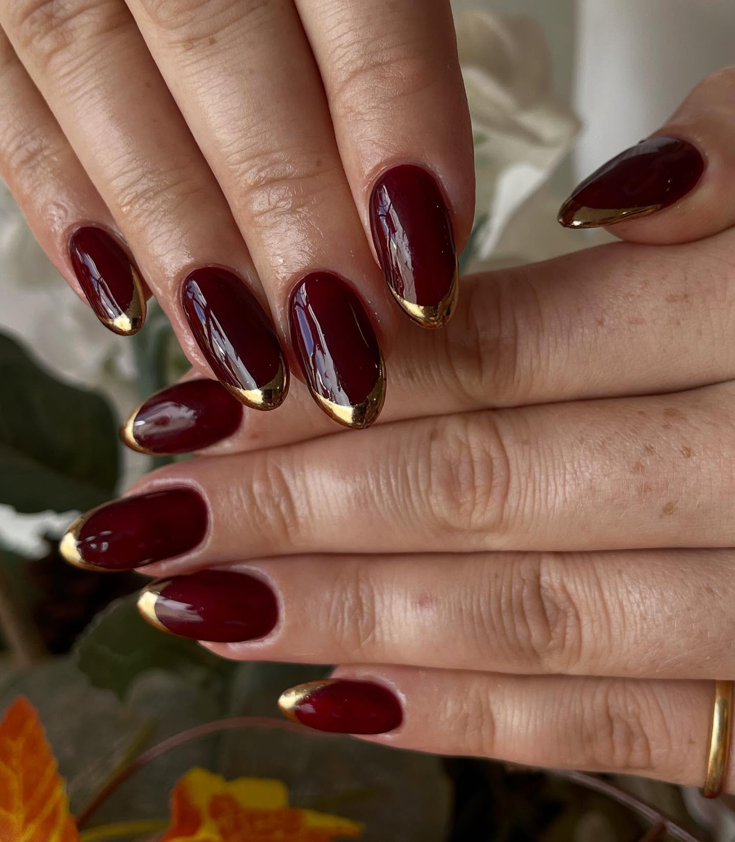 Deep Burgundy Oval Nails With Gold French Tips