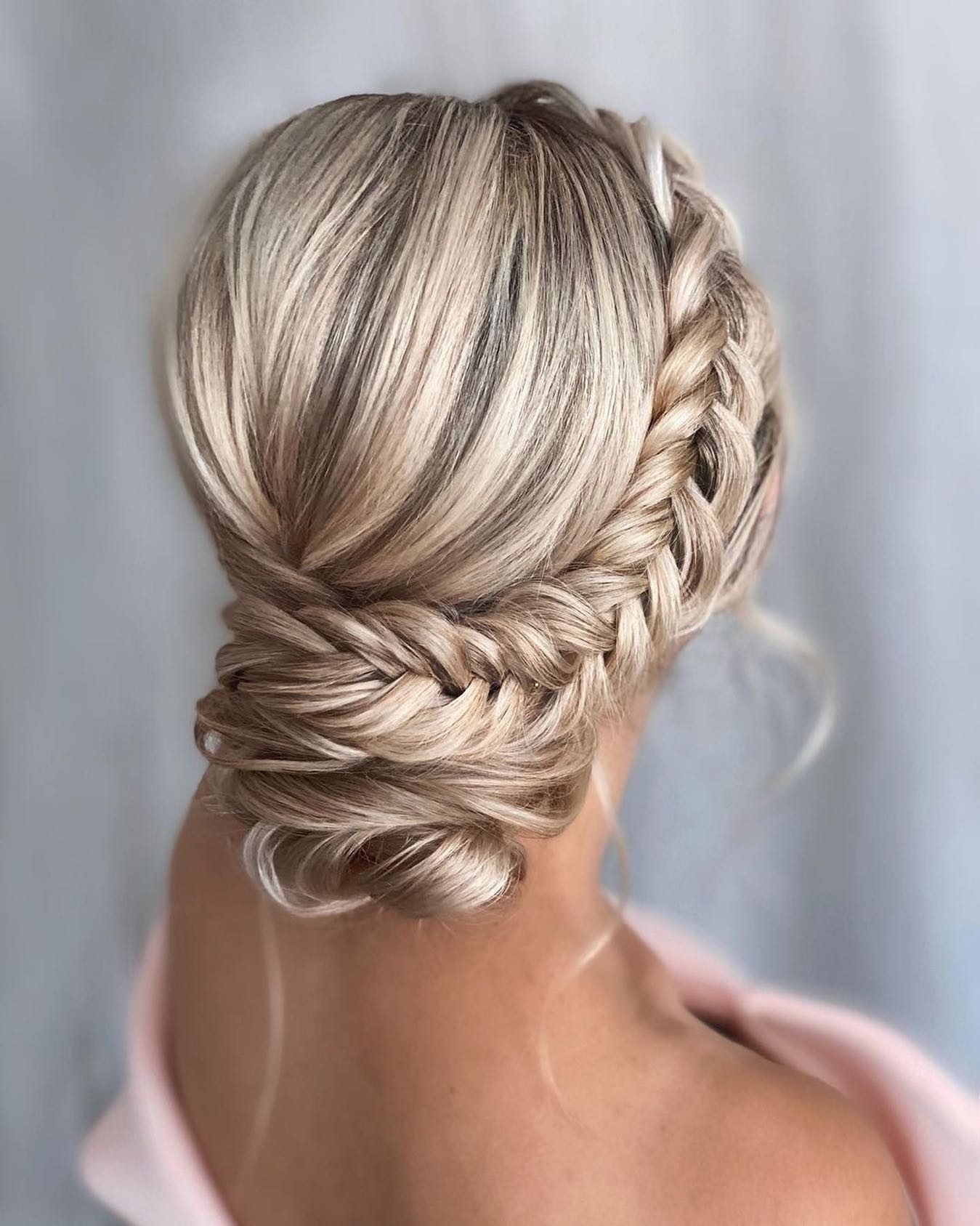 Elegant Braided Updo With Loose Tendrils