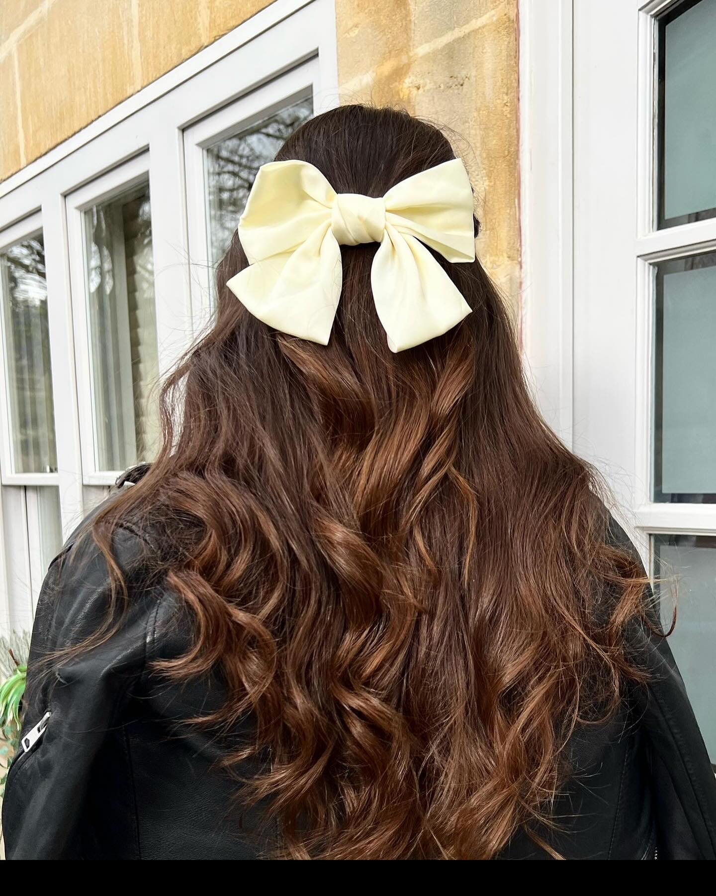 Elegant Cream Bow With Cascading Waves