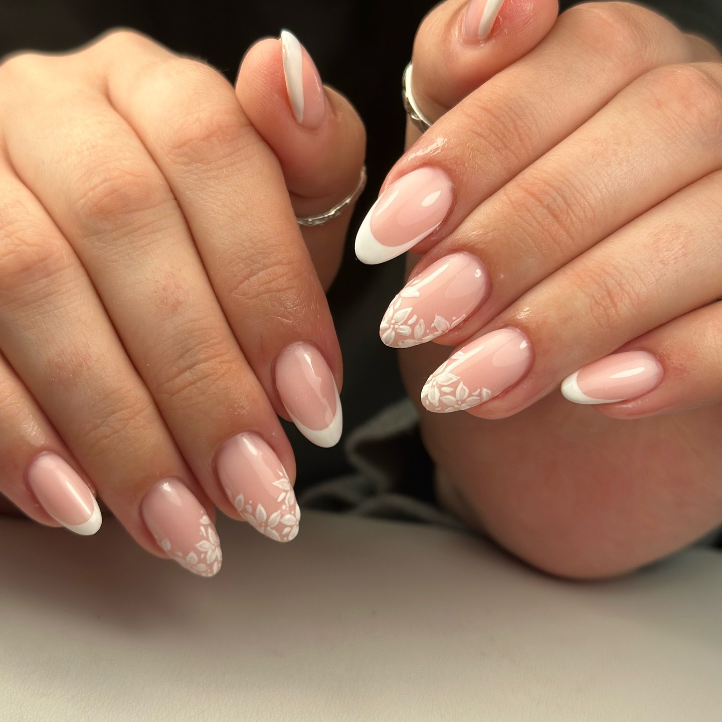 Elegant French Tips with Floral Nail Art
