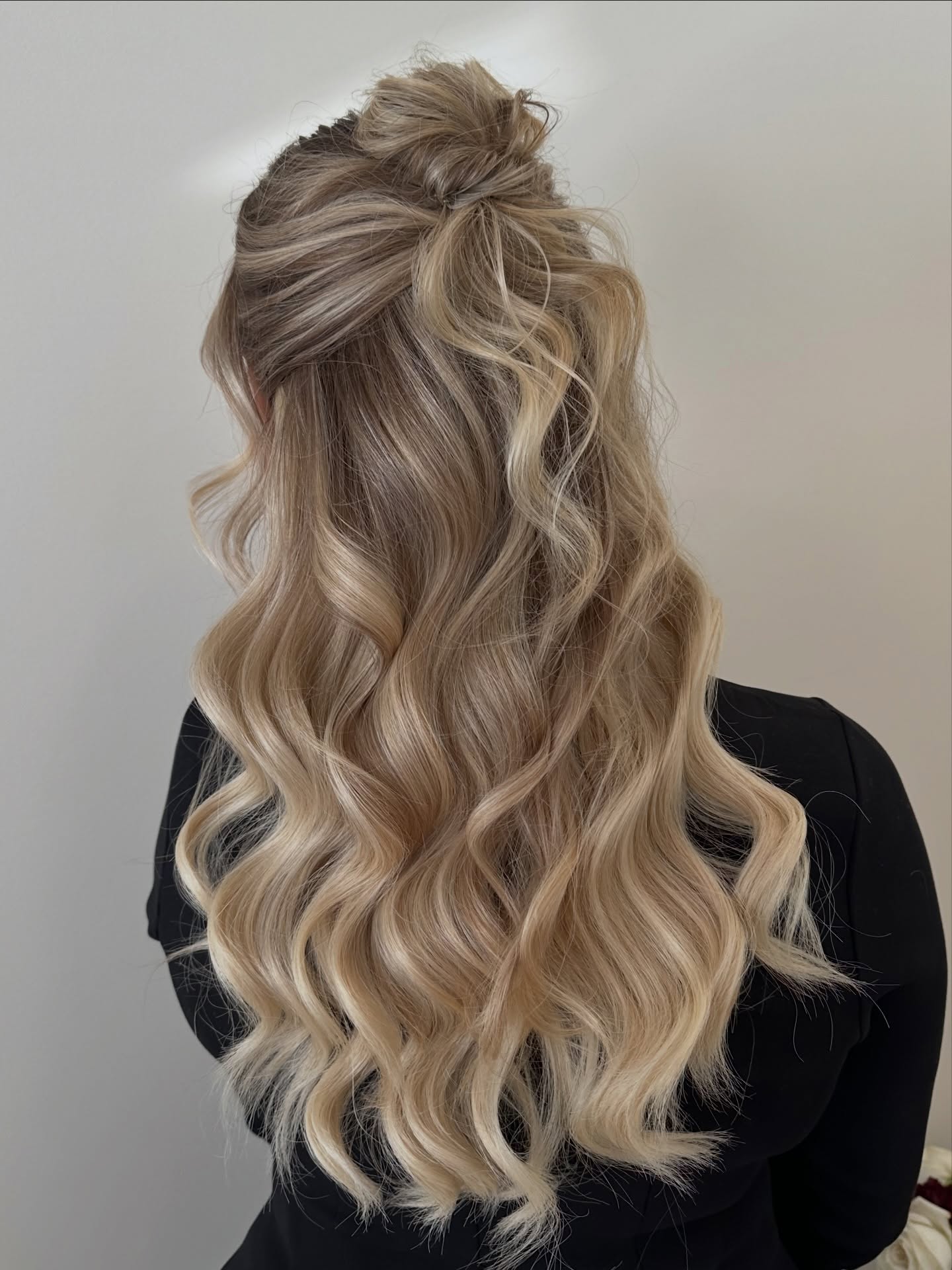 Elegant Half-Up Top Knot With Loose Waves