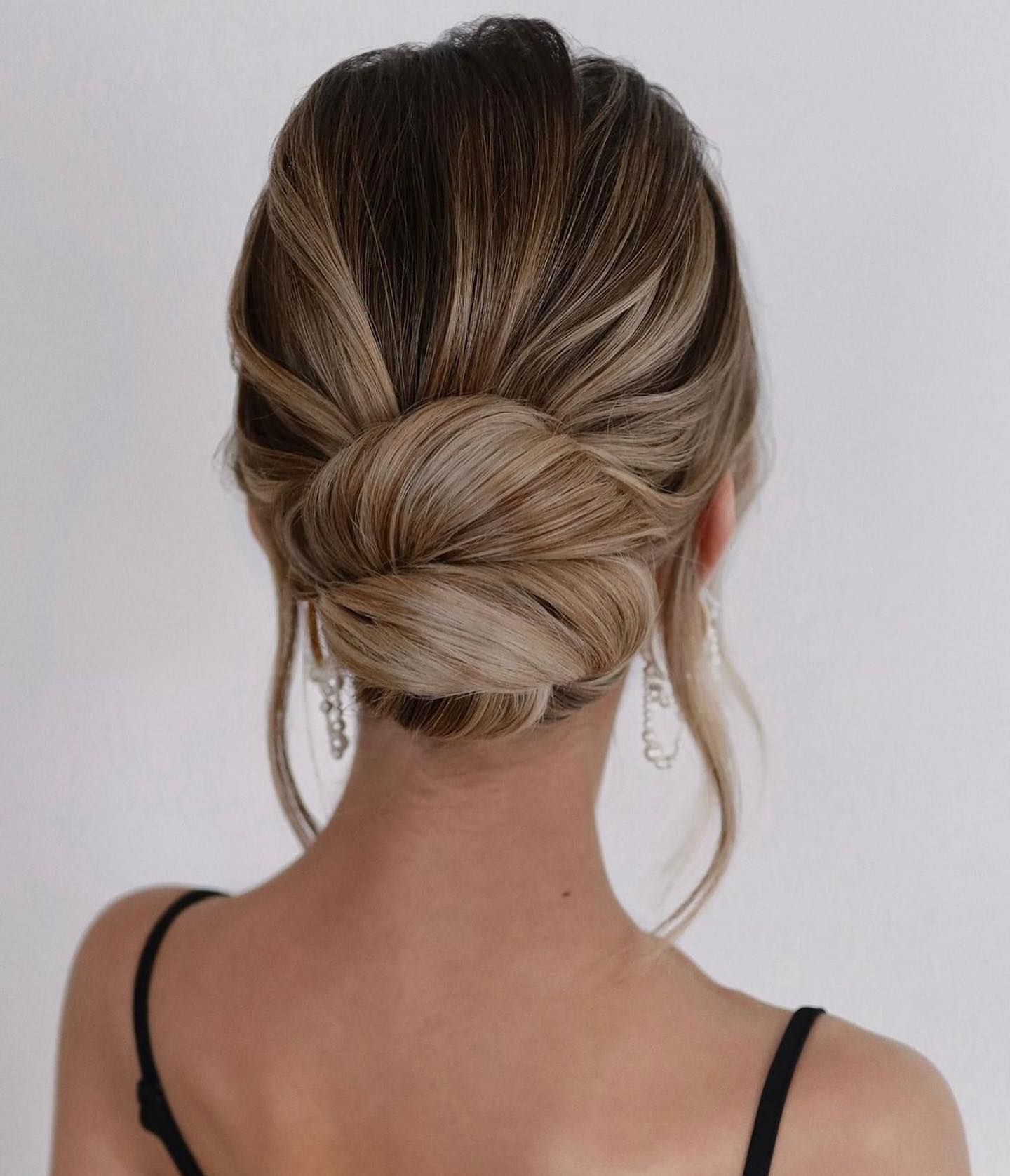 Elegant Twisted Low Bun With Face Framing Strands