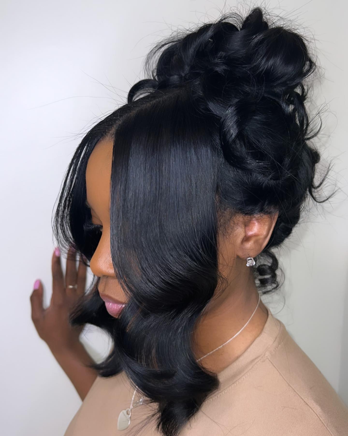 Elegant Voluminous Updo With Face-Framing Tendrils
