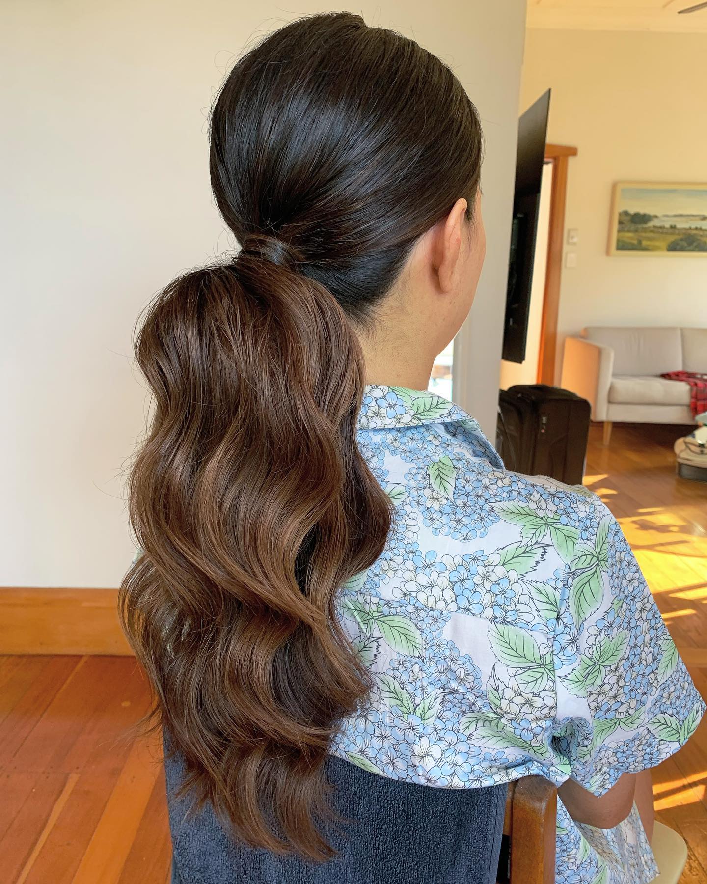 Elegant Wavy High Ponytail With Subtle Highlights