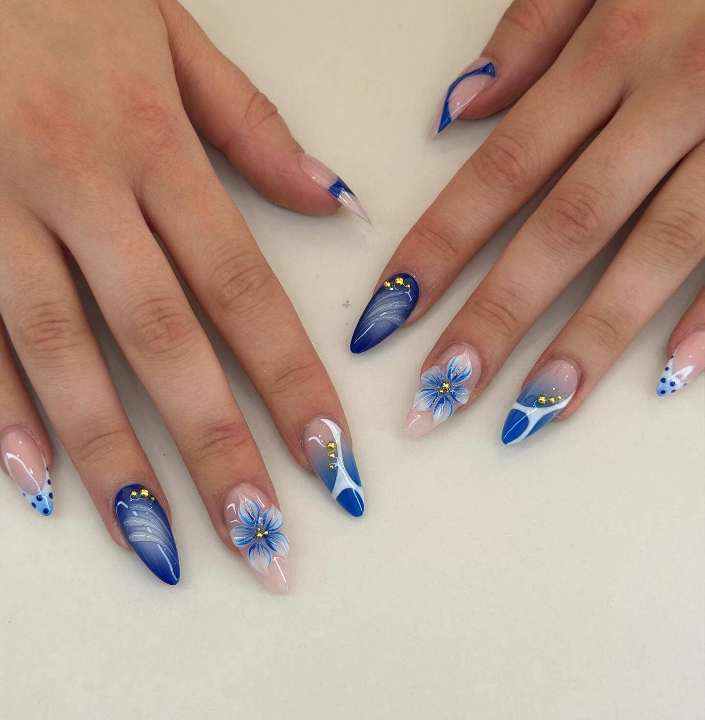 Floral Royal Blue Stiletto Nails With Gold Accents