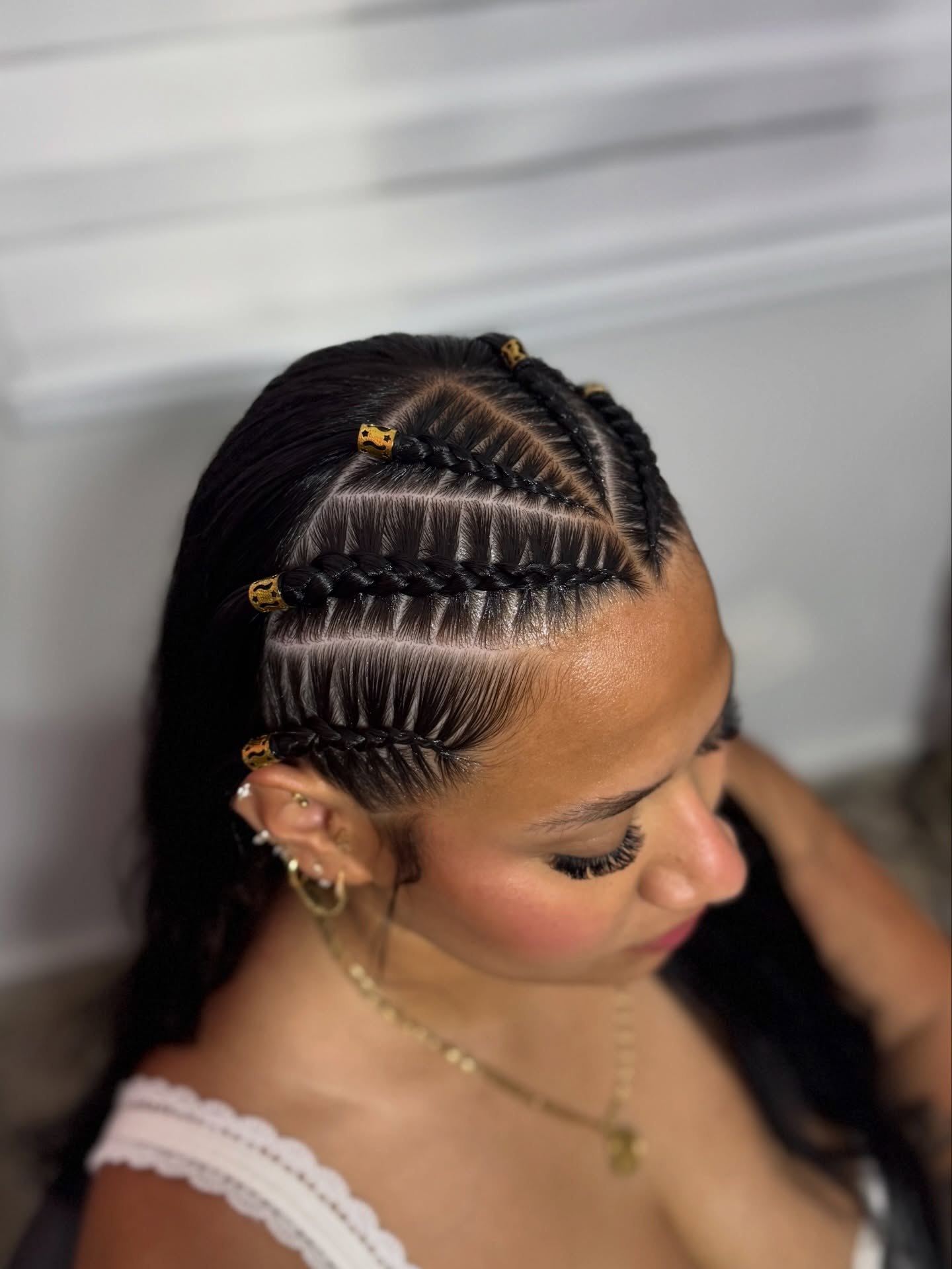 Geometric Cornrow Braids With Gold Adornments