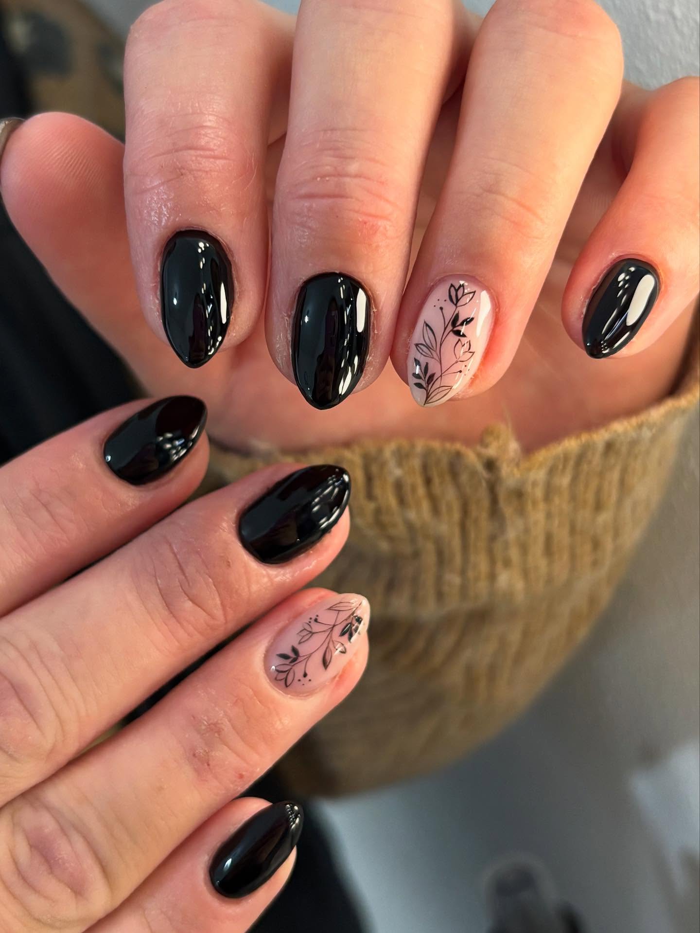 Glossy Black Almond Nails with Delicate Floral Art