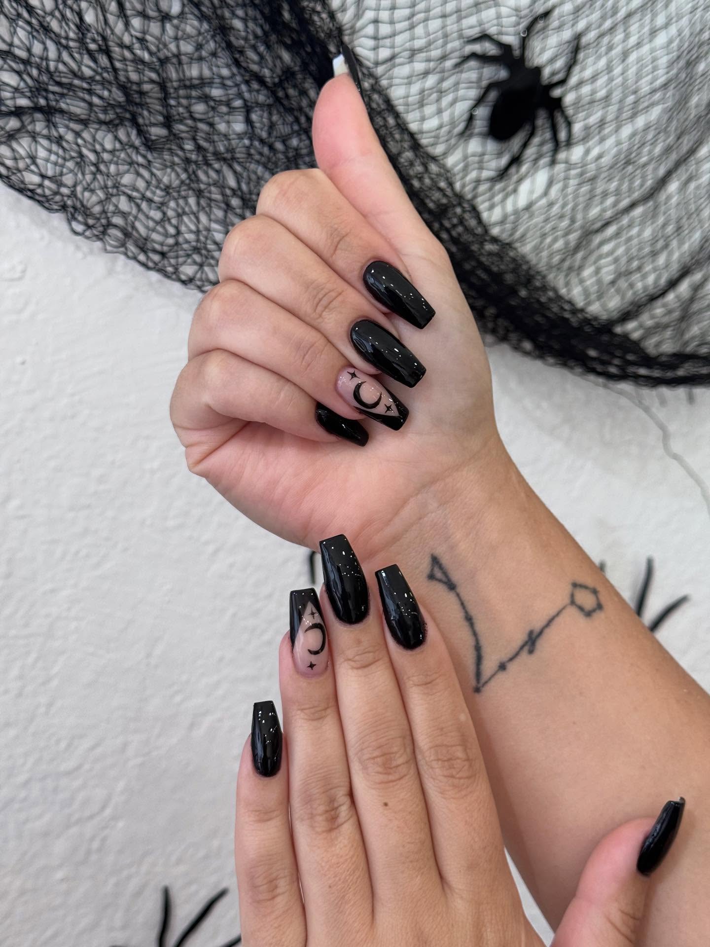 Glossy Black Coffin Nails with Celestial Accents