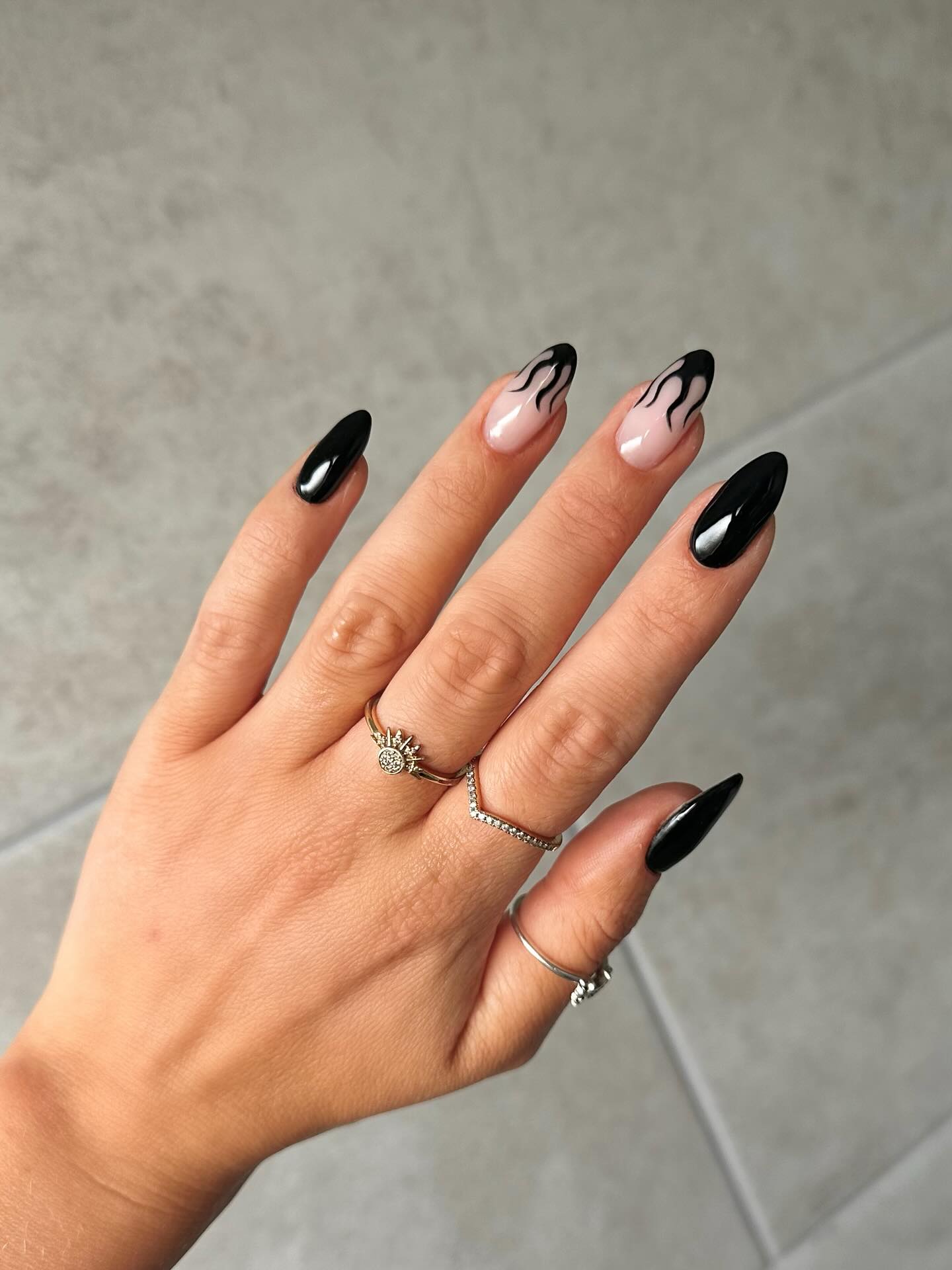 Glossy Black Flame Almond Nails