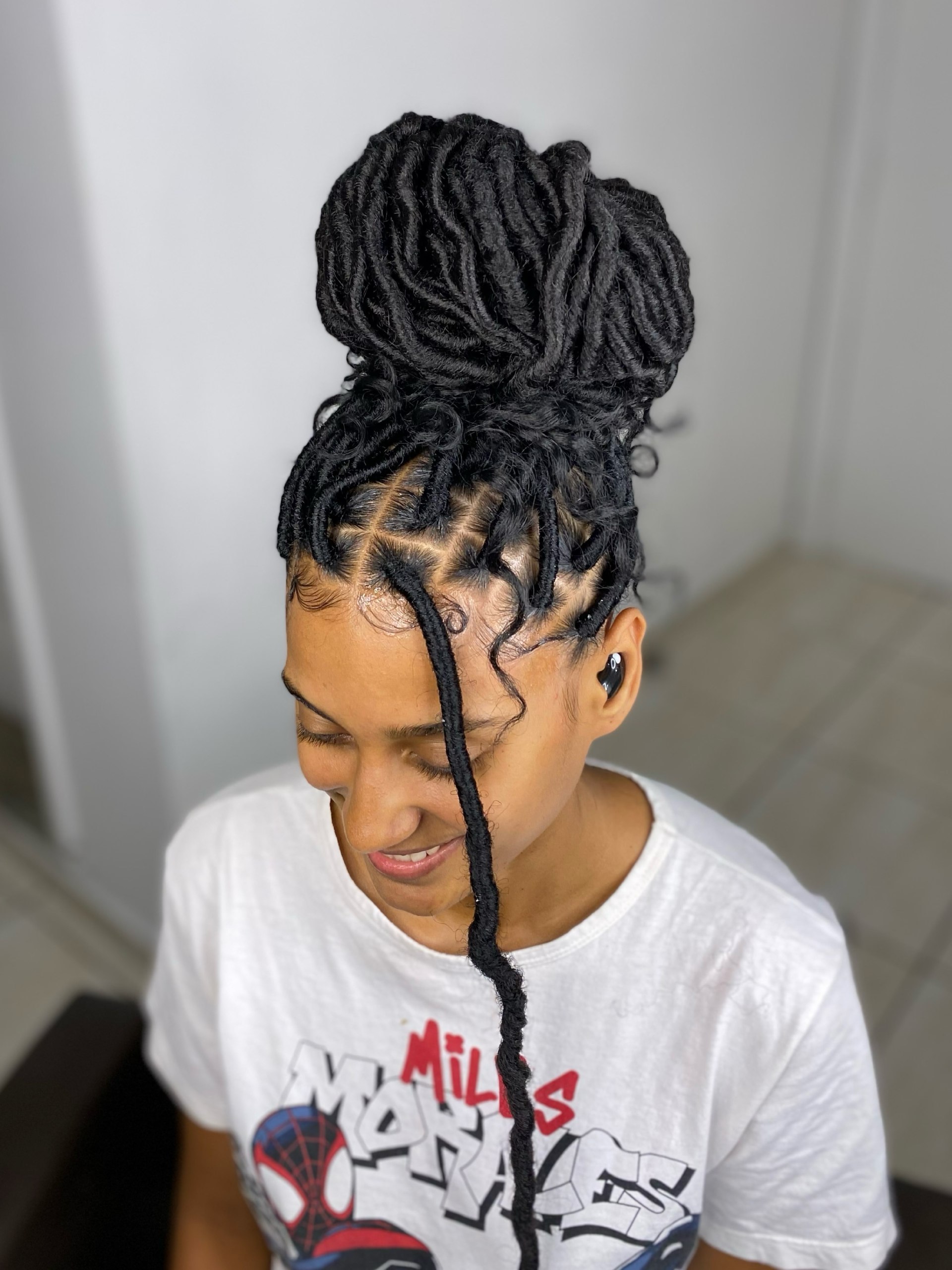 High Messy Bun With Detailed Faux Locs