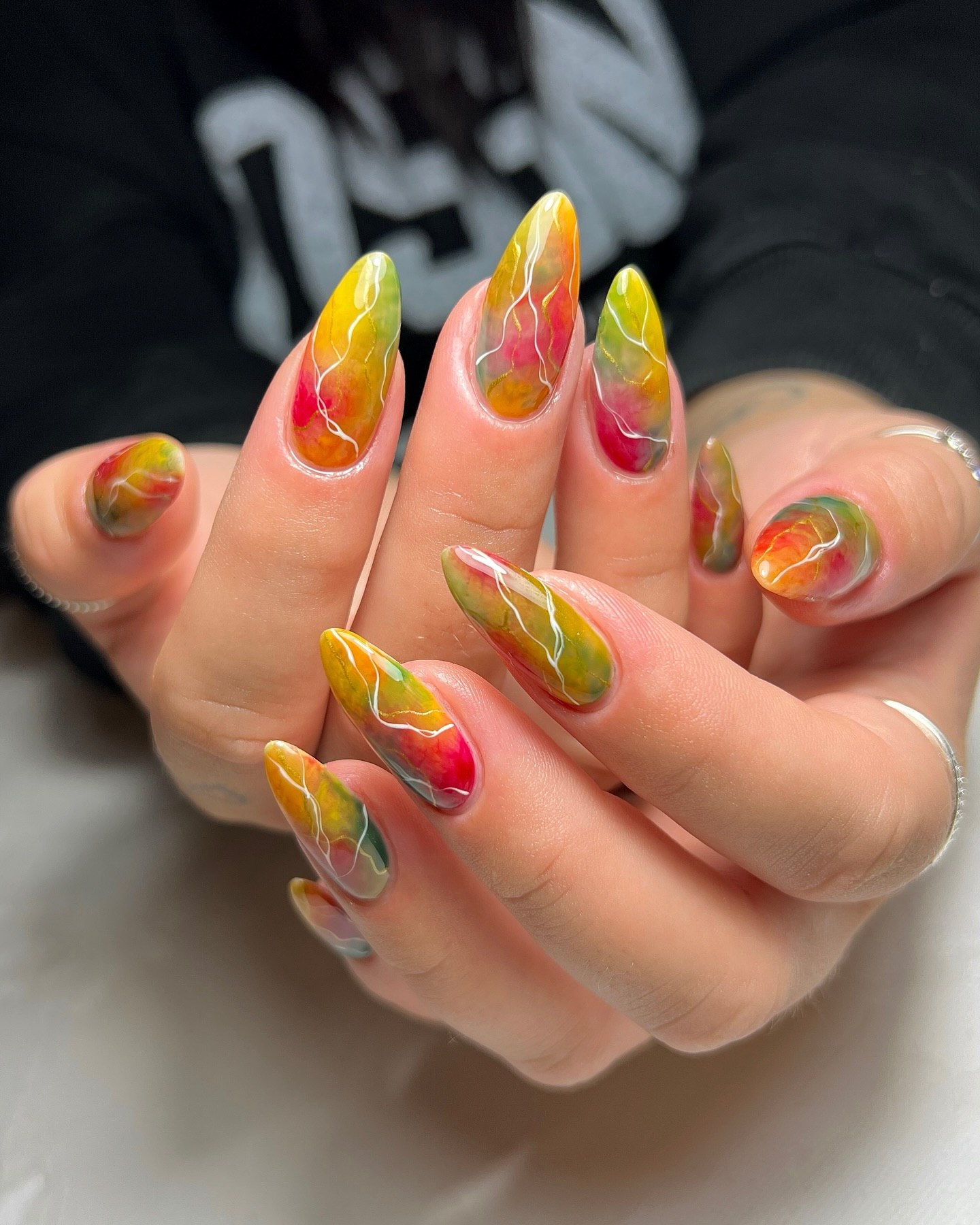 Marbled Yellow, Pink, and Green Almond Nails