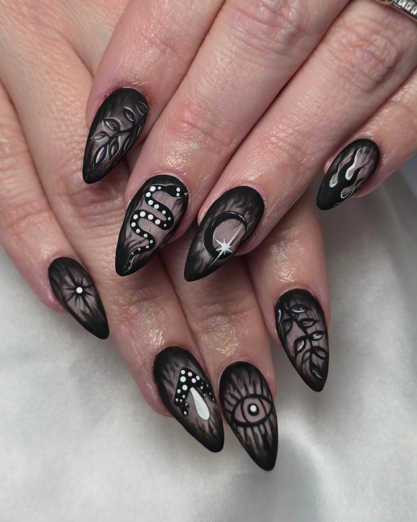 Matte Black Mystical Creature Almond Nails