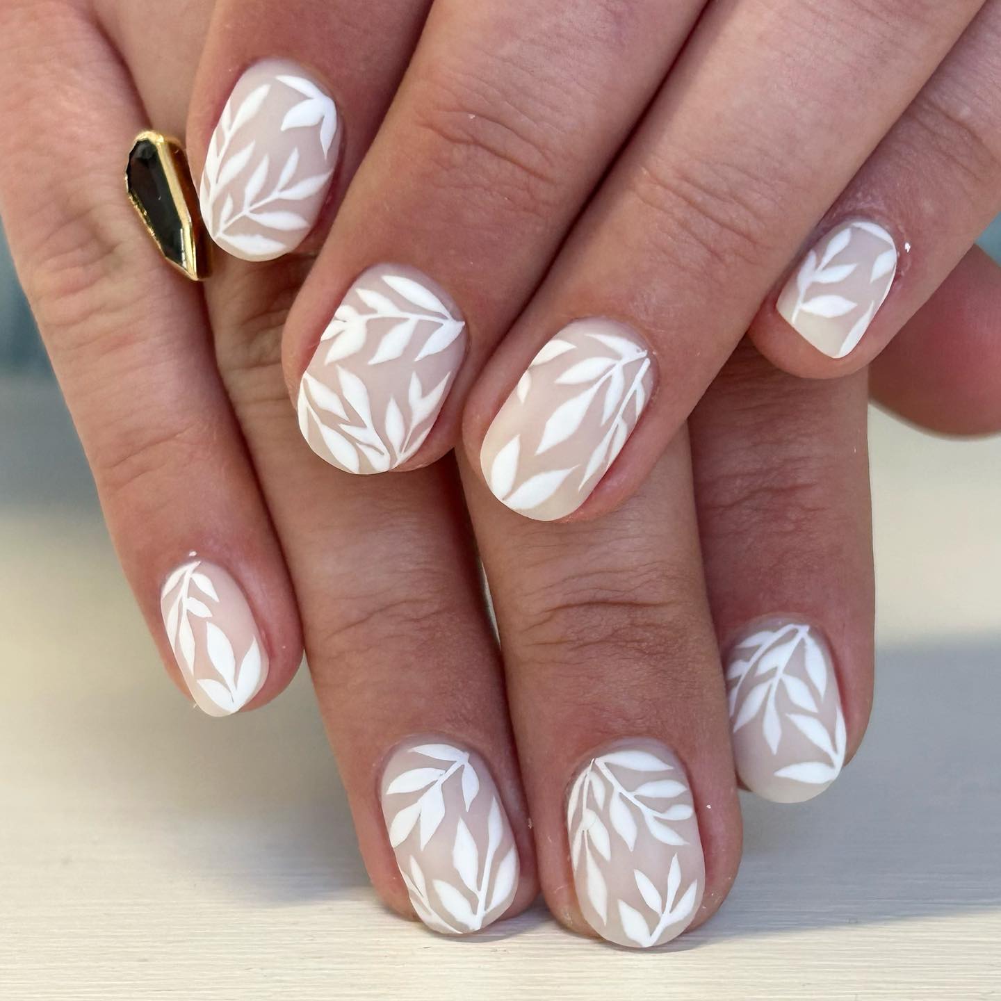 Matte Nude with Delicate White Leaf Art