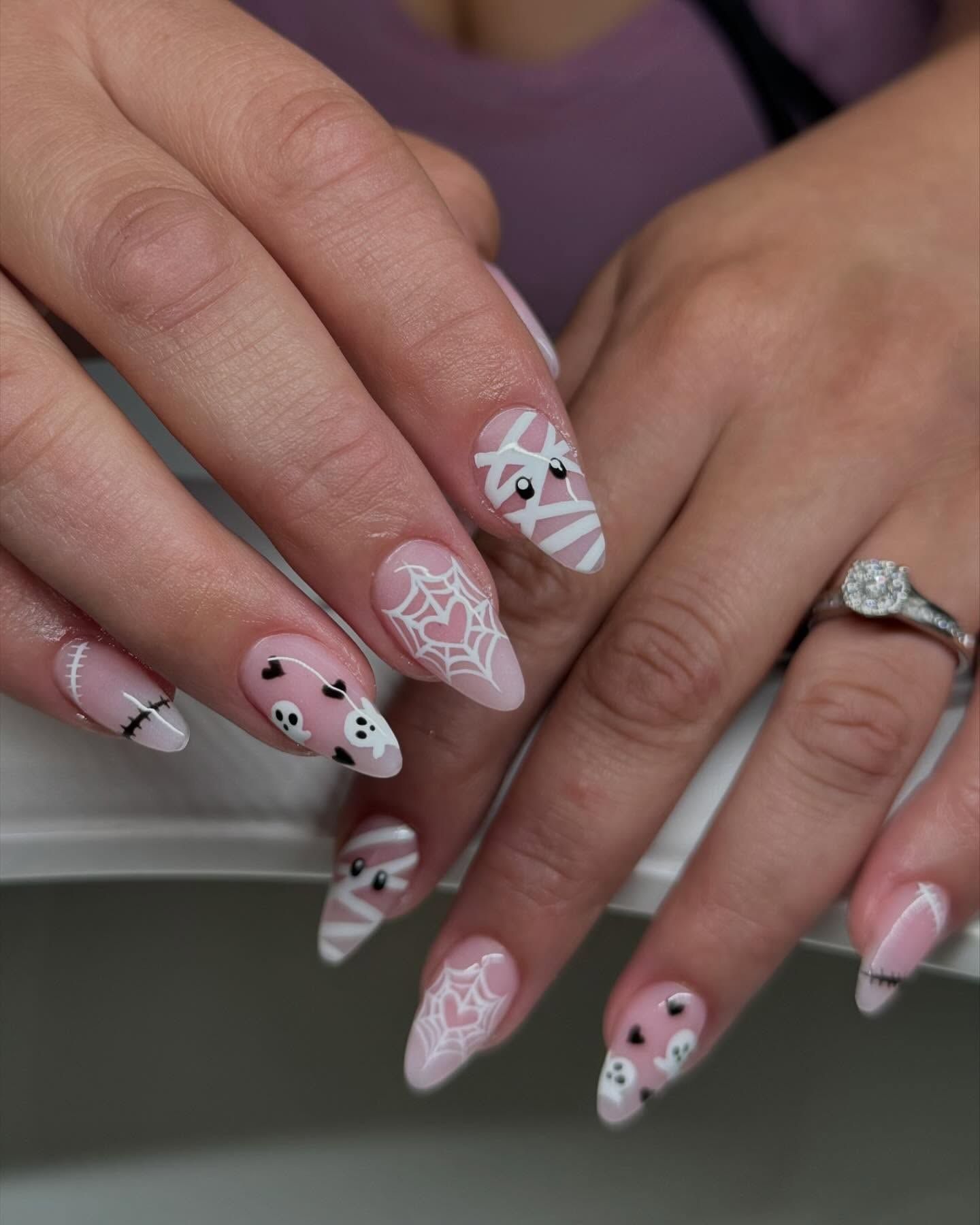 Playful Halloween Mummy and Spiderweb Almond Nails