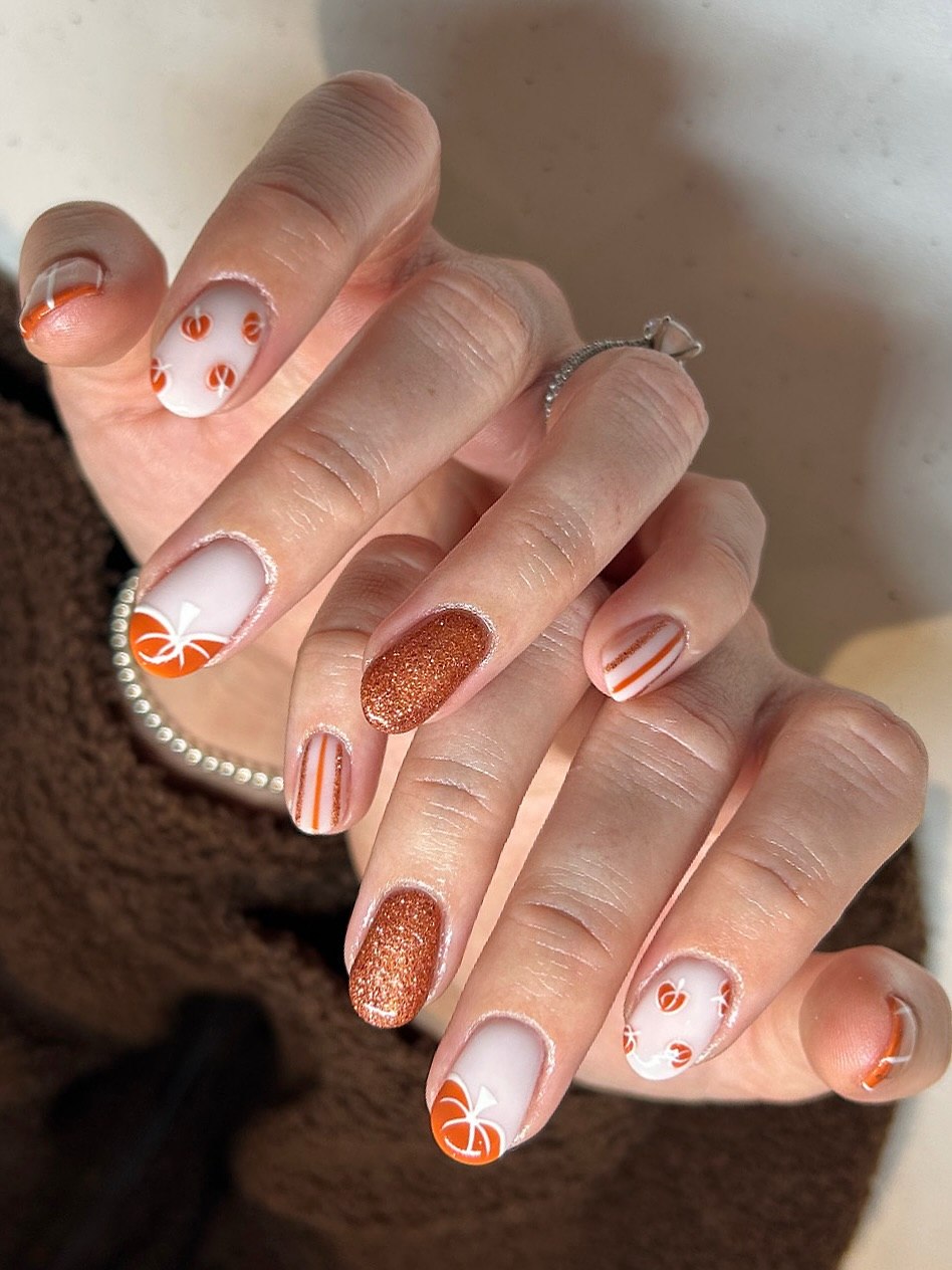 Pumpkin Patch French Tip & Glitter Manicure
