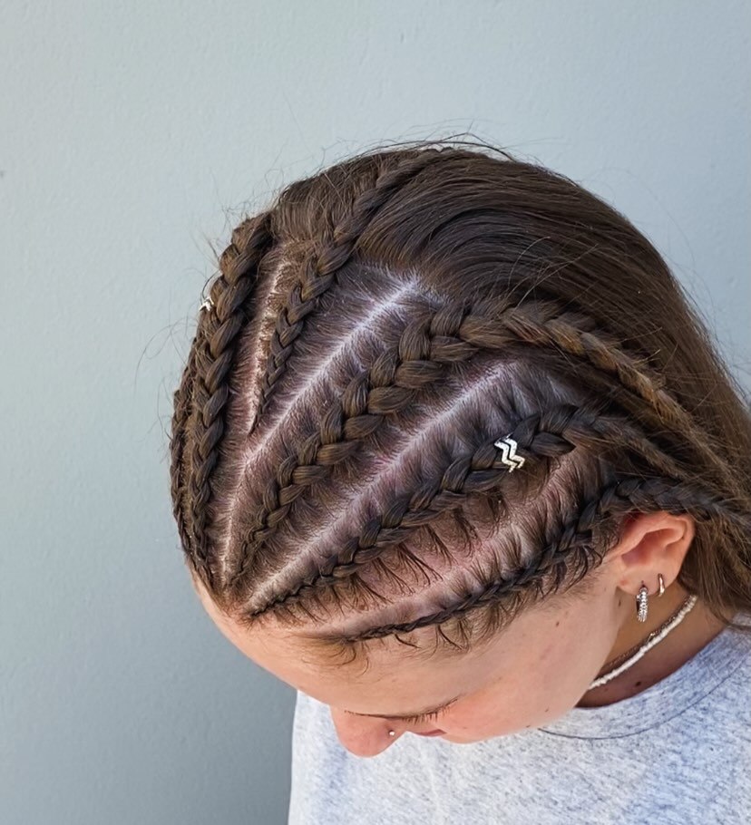 Sleek Cornrow Braids With Metallic Hair Accessories