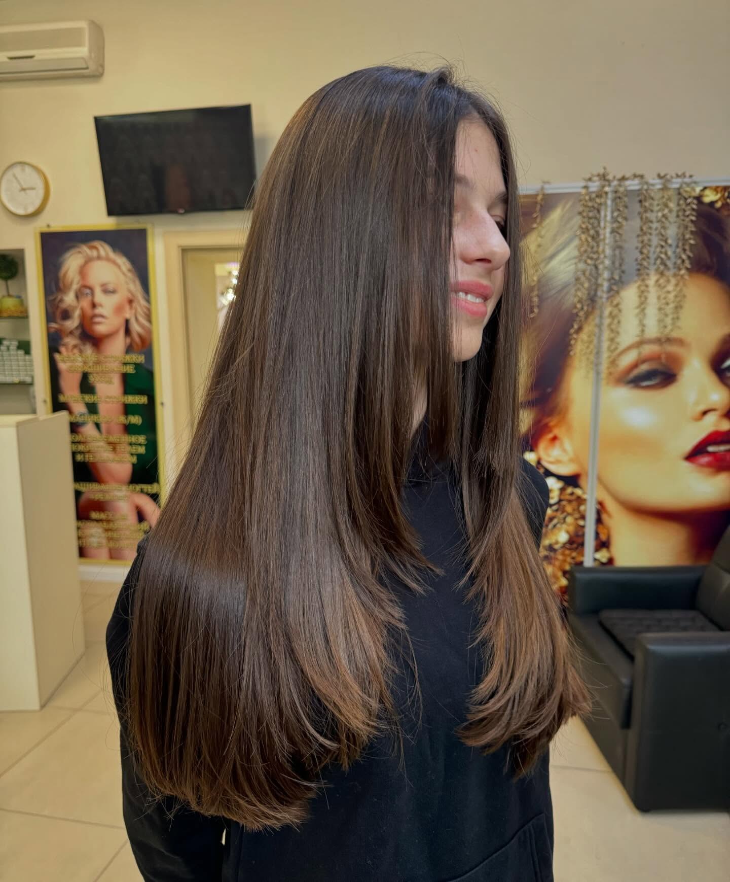 Sleek Mid Back Length Hair With Subtle Layers