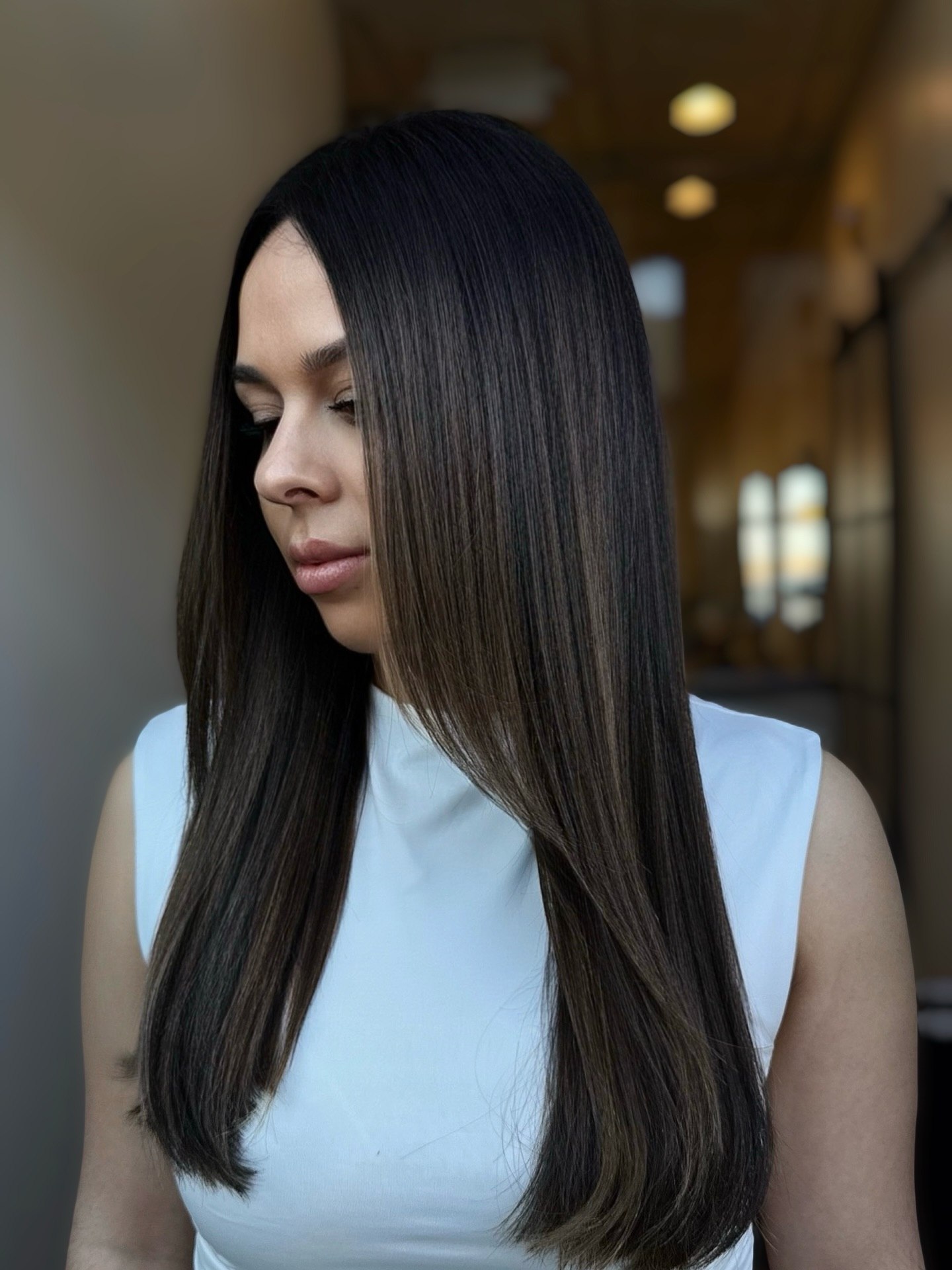 Sleek Polished Brunette With Subtle Face Framing