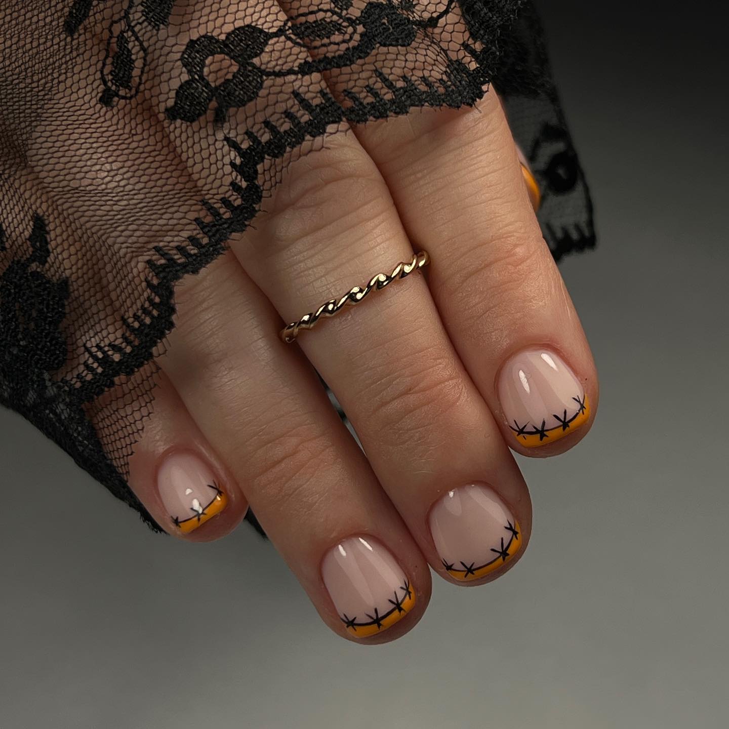 Stitched Pumpkin French Tip Halloween Nails