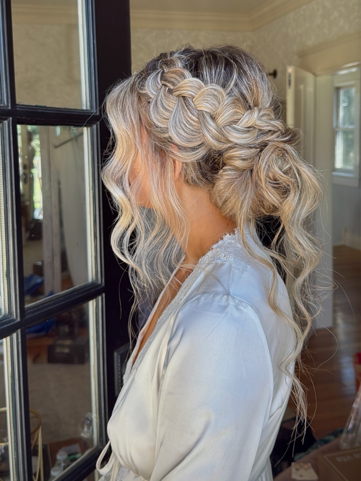 Textured Braided Low Bun With Face Framing Waves