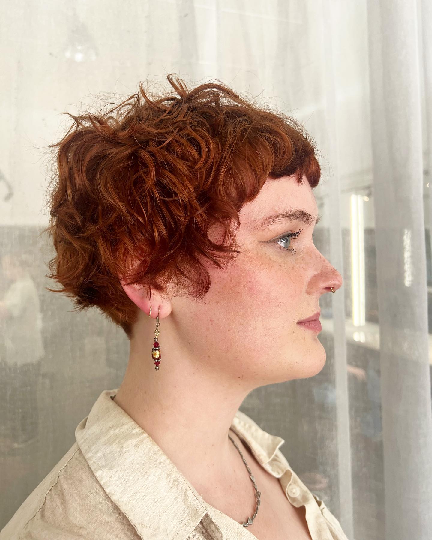 Textured Copper Curly Pixie With Baby Bangs