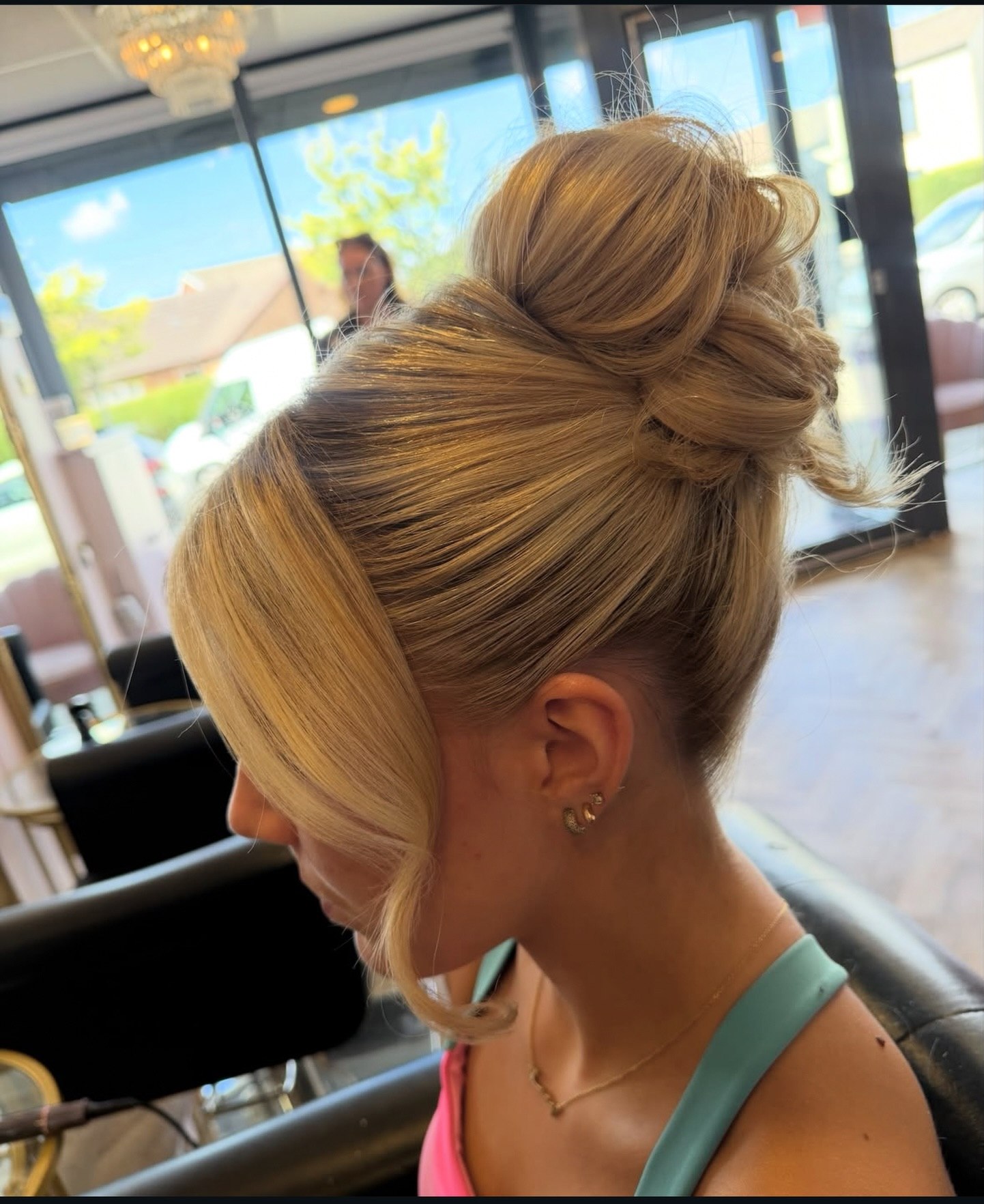 Textured High Bun With Face Framing Strands