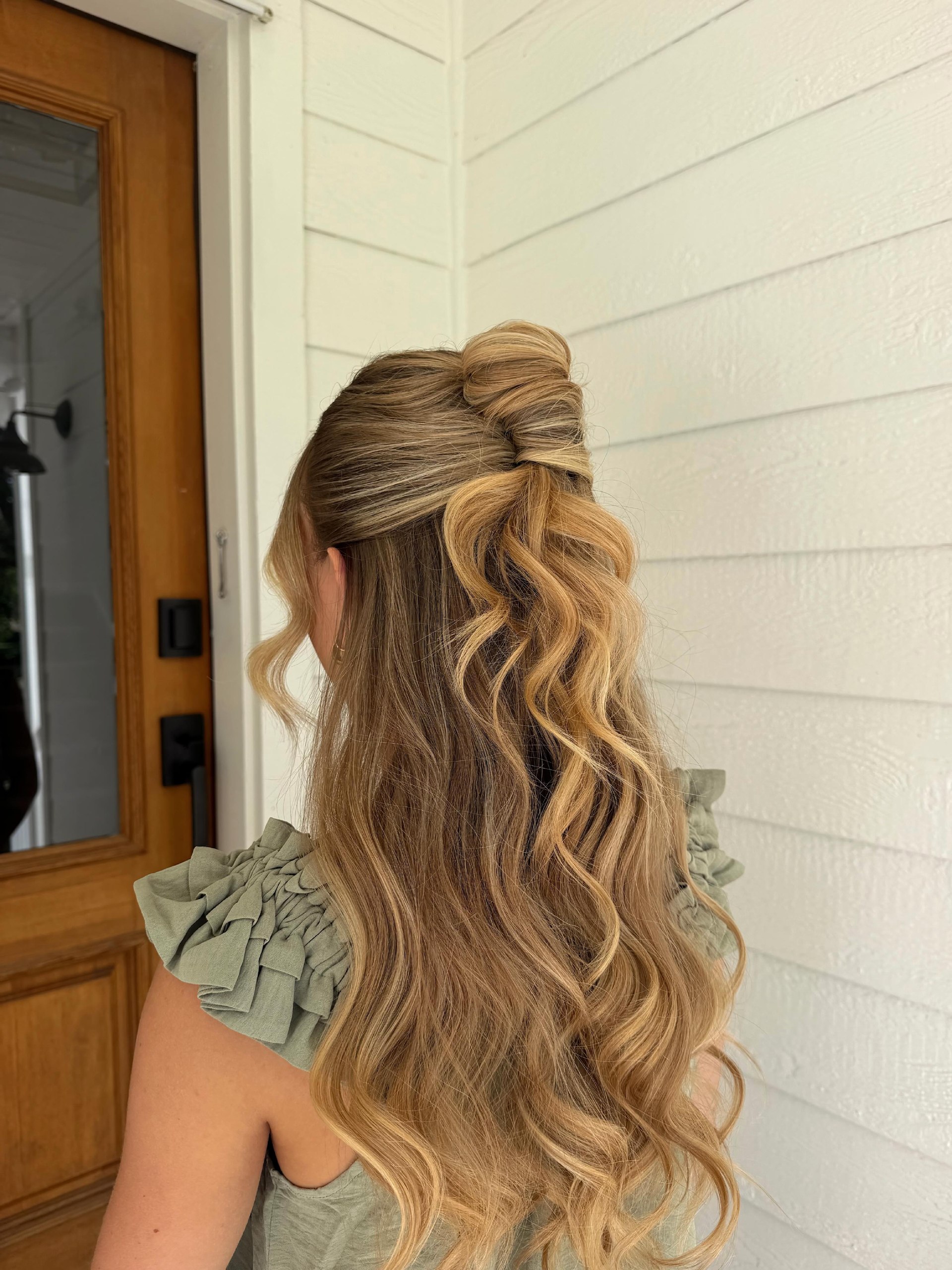 Twisted Half-Up Bun With Loose Barrel Curls