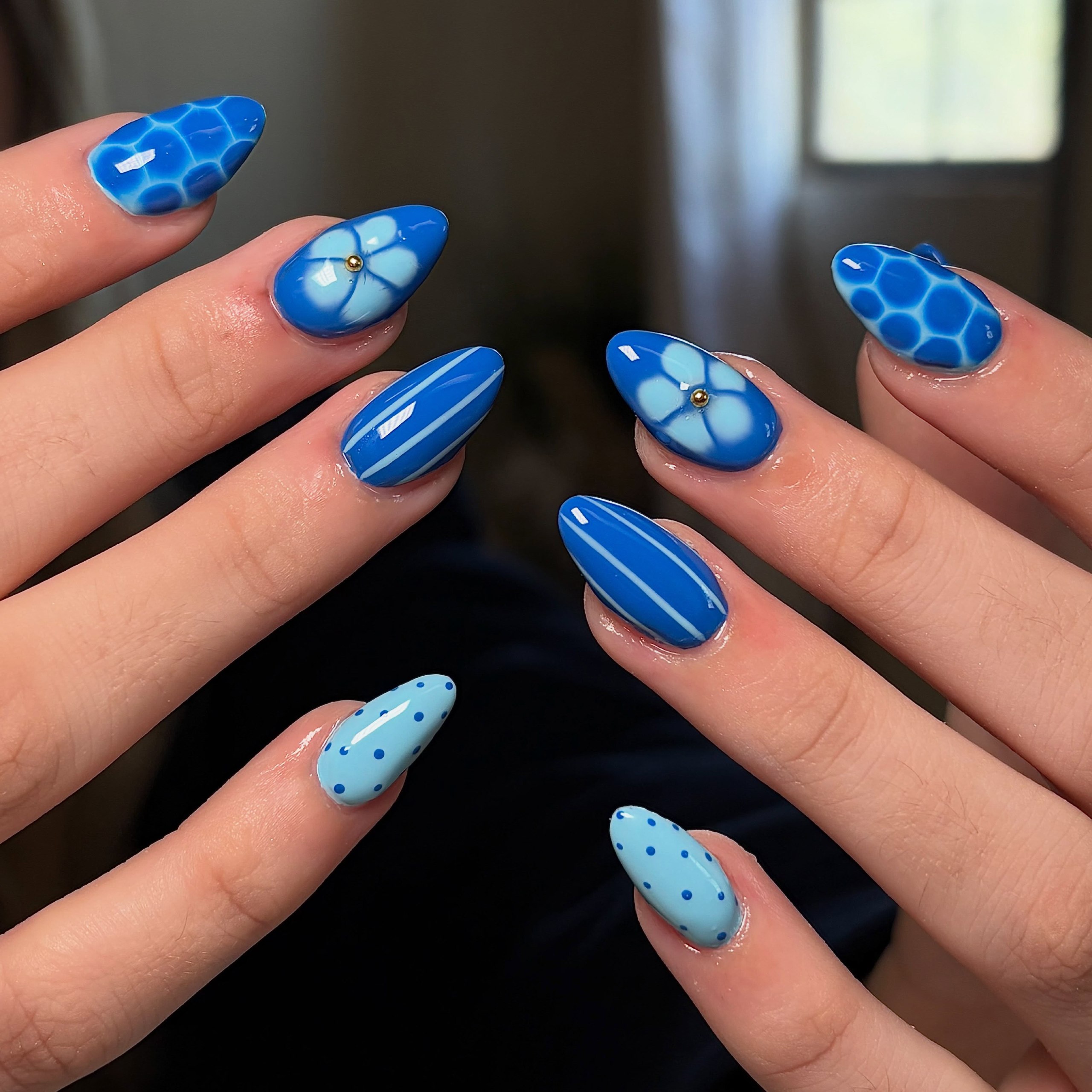 Vibrant Blue Mismatched Pattern Almond Nails