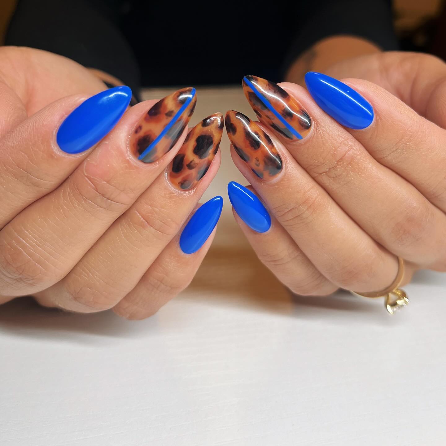 Vibrant Blue Tortoiseshell Almond Nails