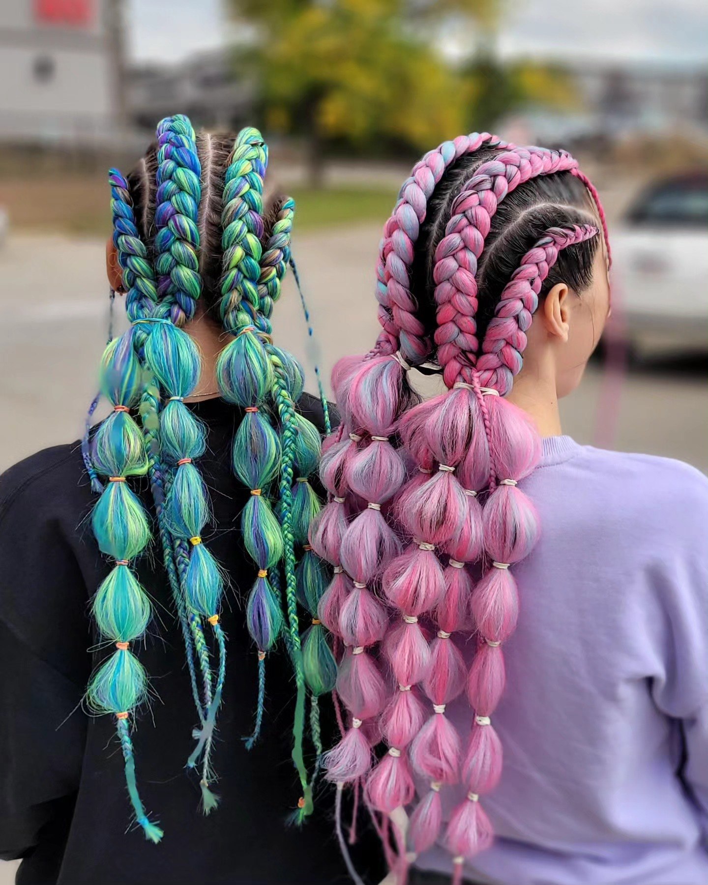 Vibrant Bubble Braids with Teal and Pink Streaks