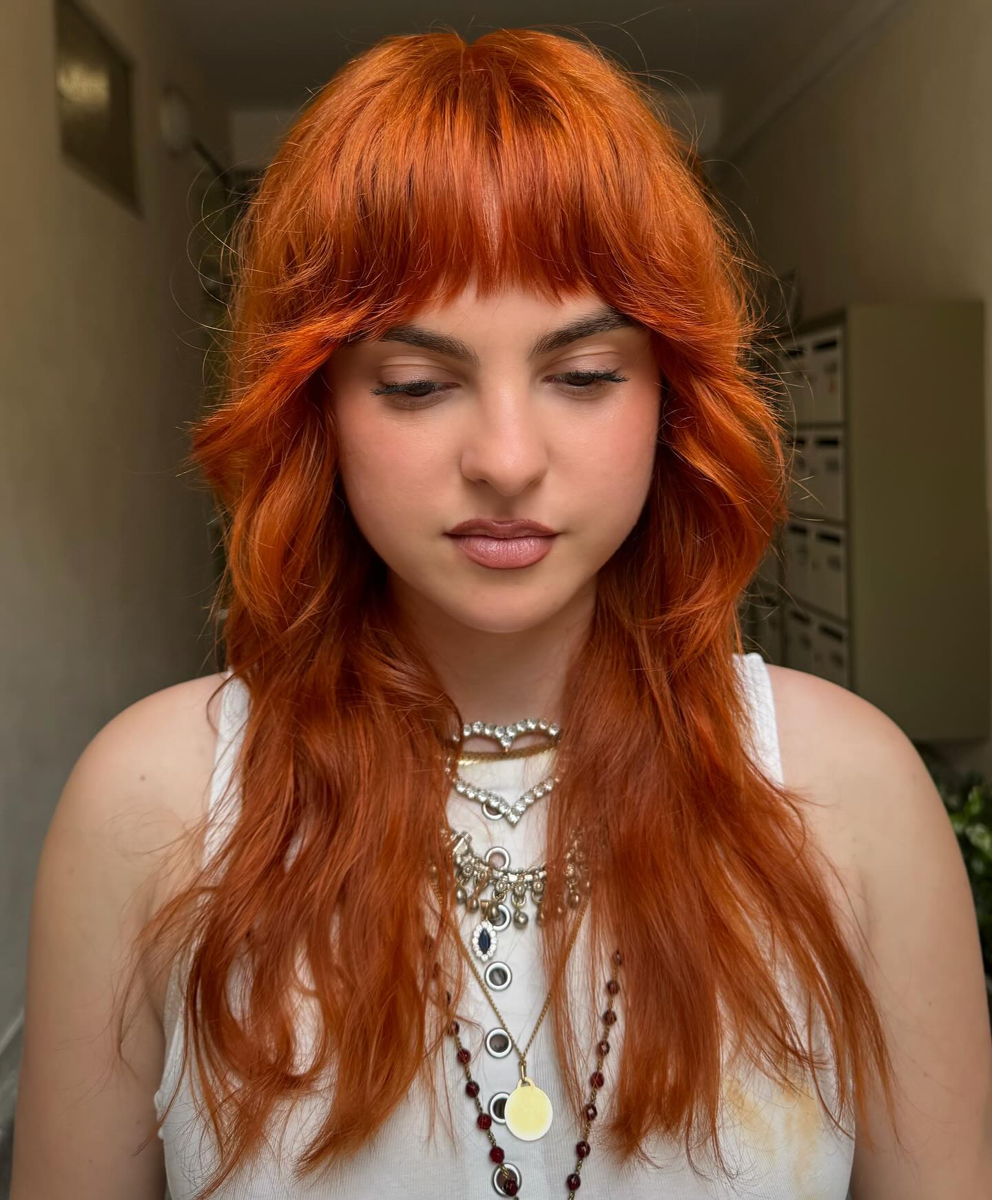 Vibrant Copper Shag With Textured Wispy Bangs