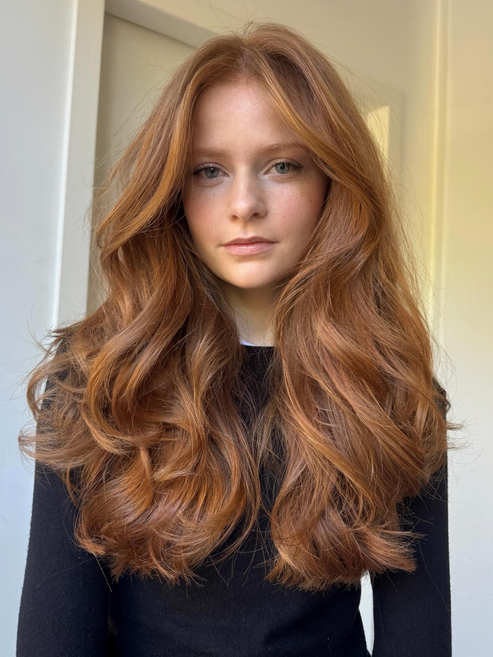 Voluminous Copper Layers With Soft Curtain Bangs