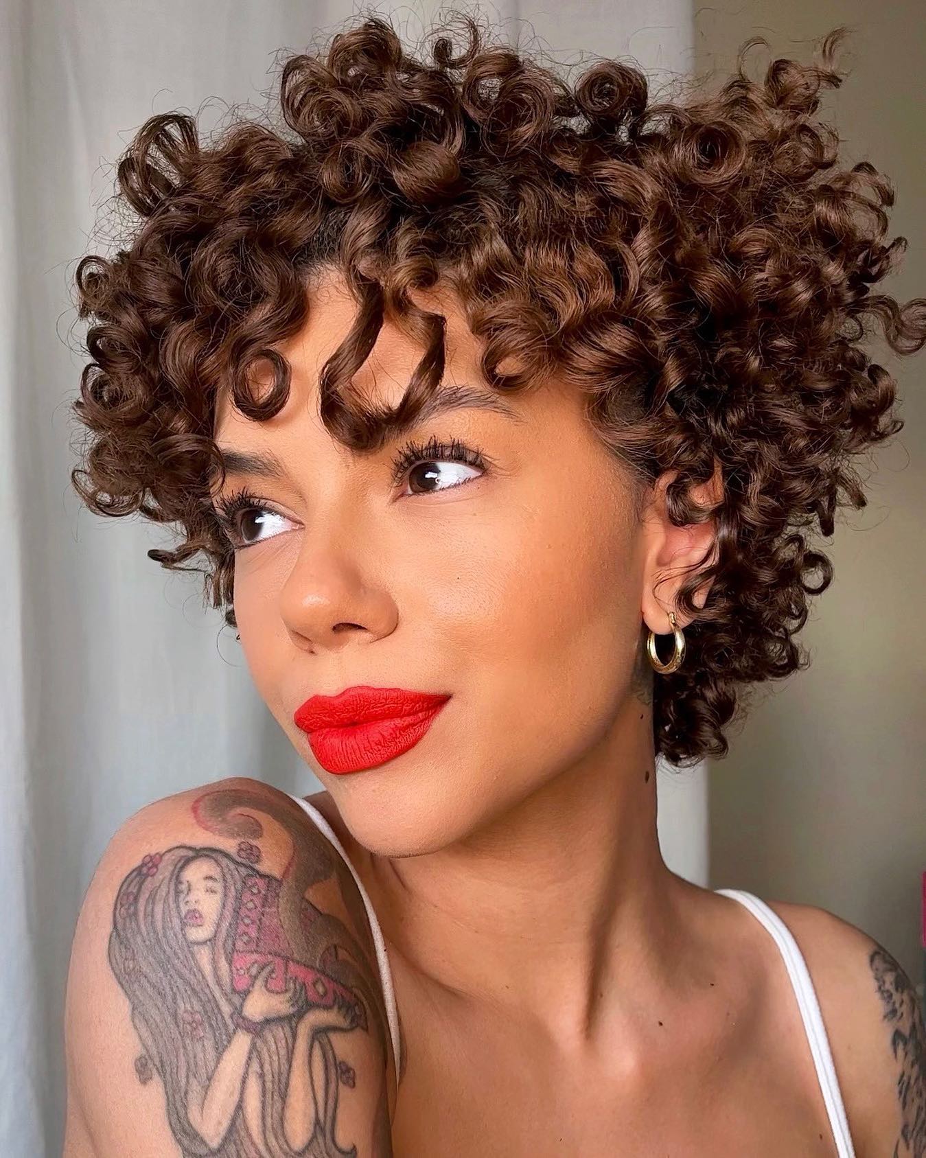 Voluminous Curly Pixie With Natural Mocha Tones