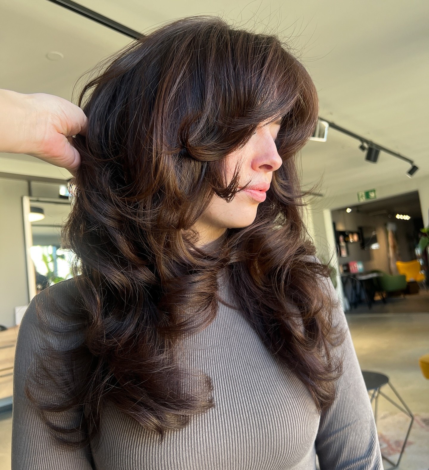 Voluminous Layered Cut With Bouncy Curtain Bangs