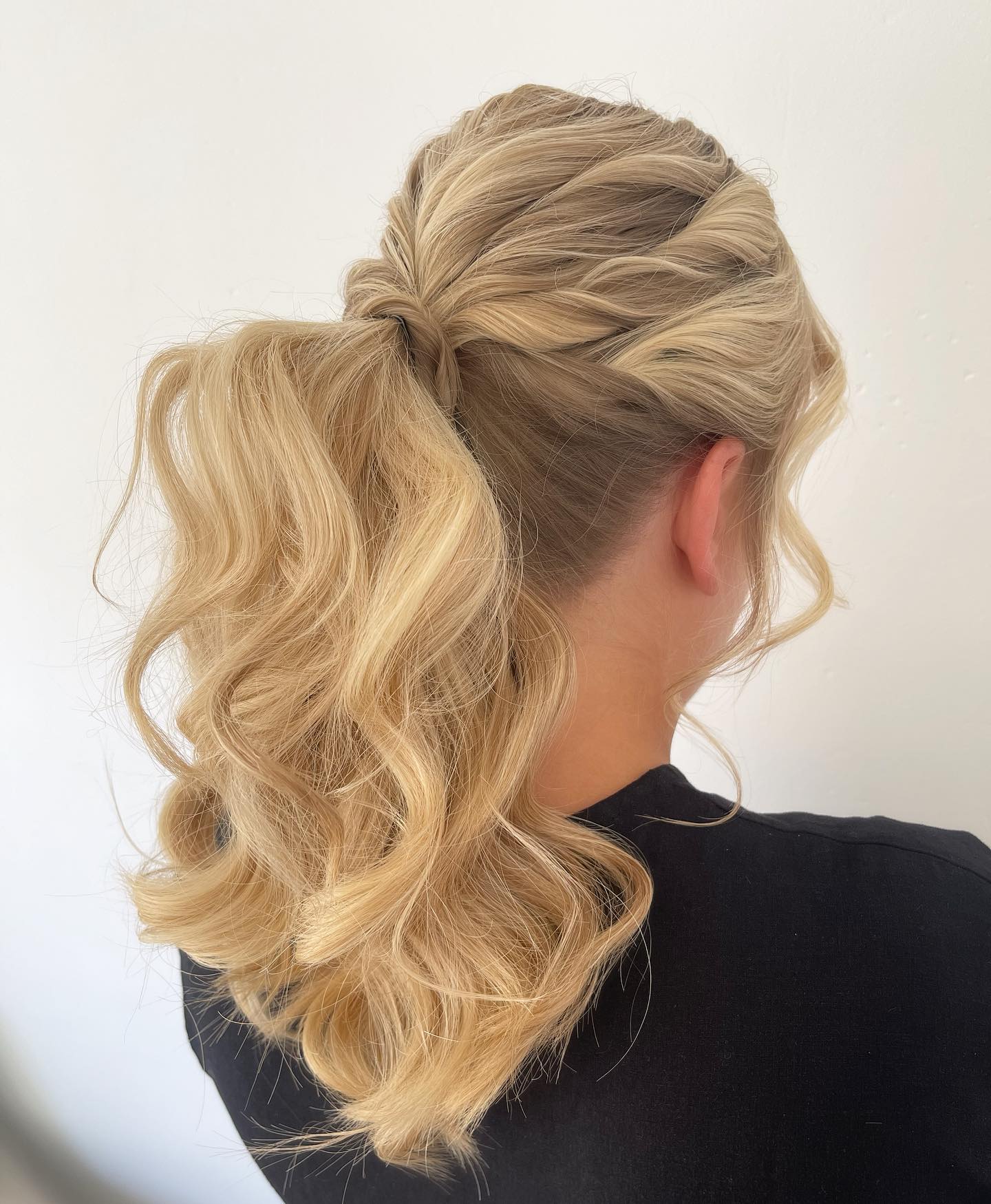 Voluminous Twisted Low Ponytail With Soft Beach Waves