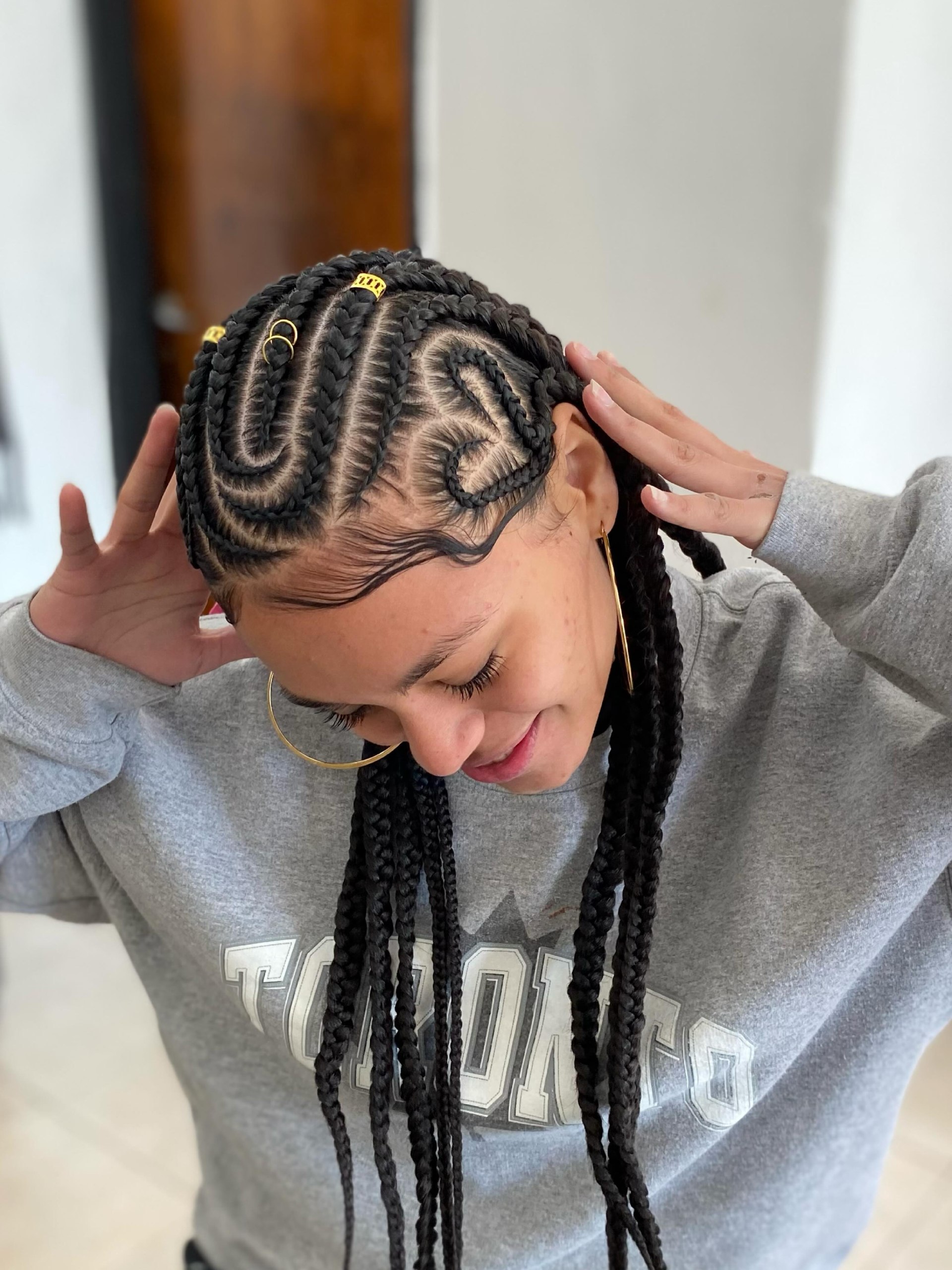 Artistic Feed-In Braids With Gold Accents