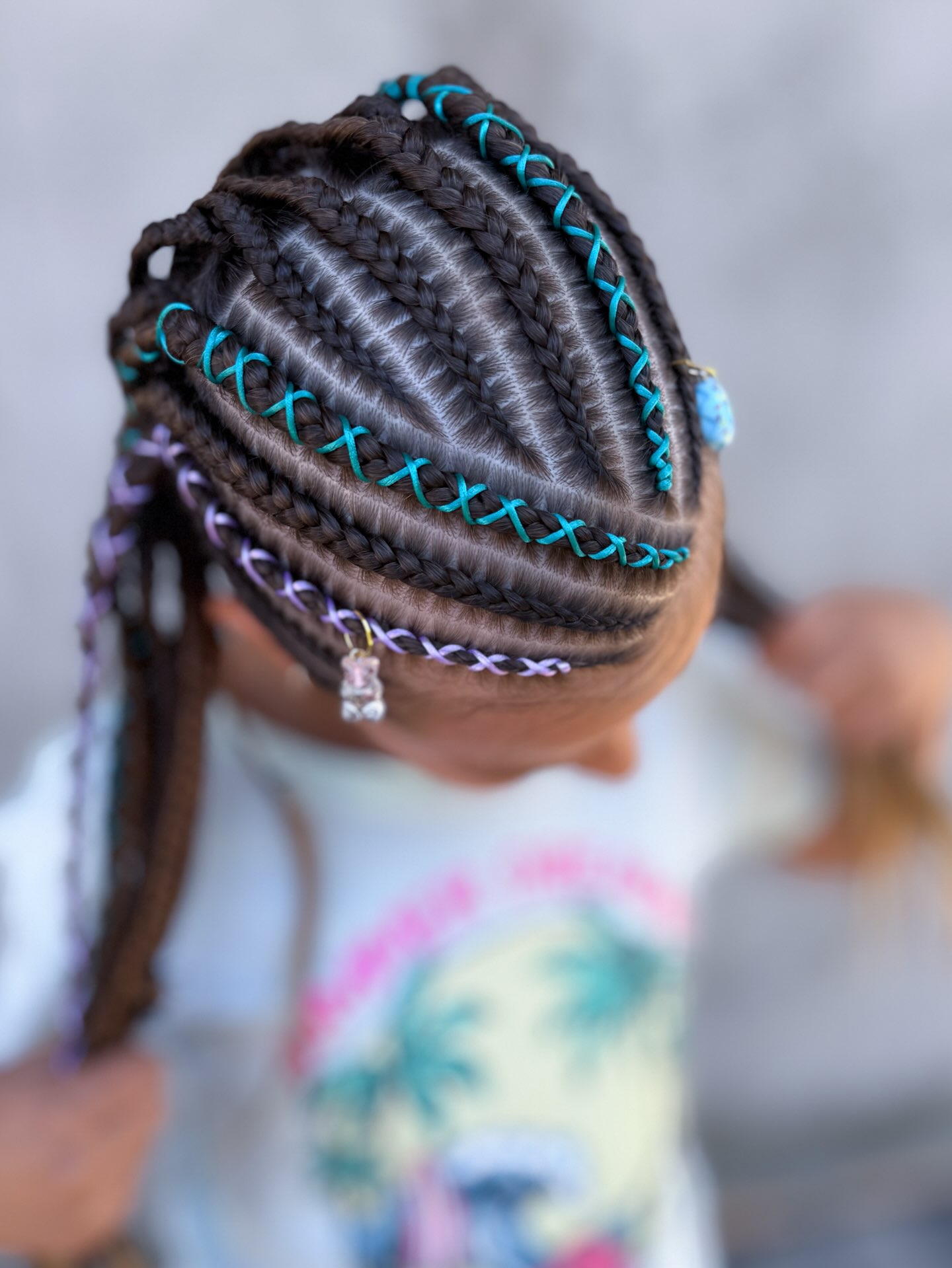 Bold Cornrows With Teal And Lavender Accents