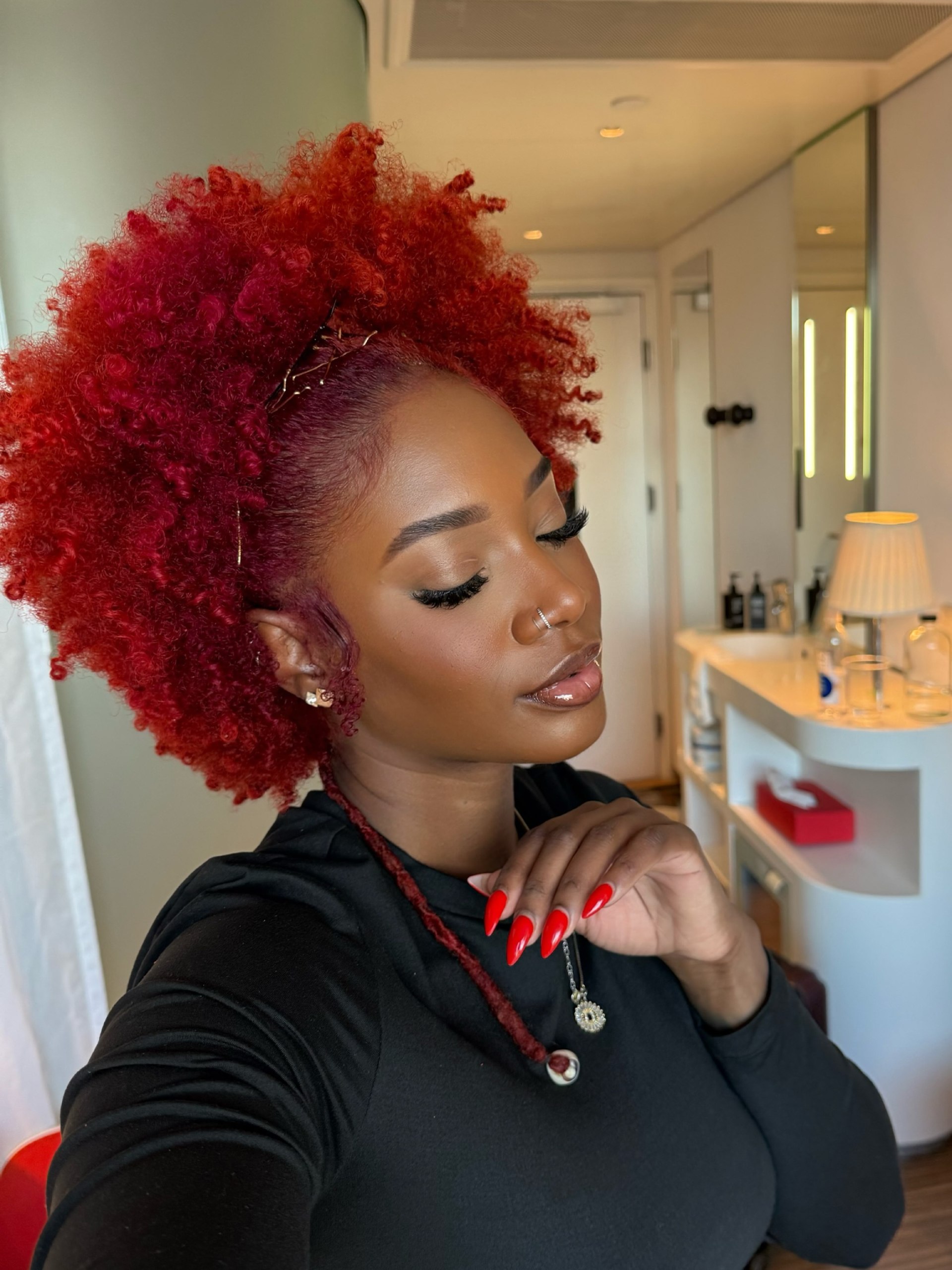 Bold Crimson Afro With Defined Curls