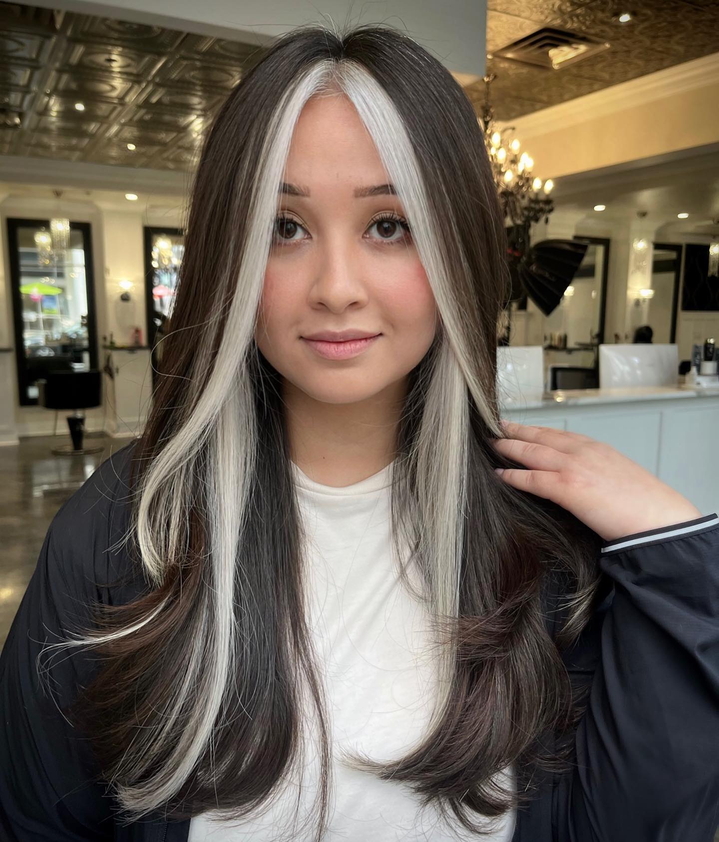 Bold Face-Framing Highlights on Dark Hair