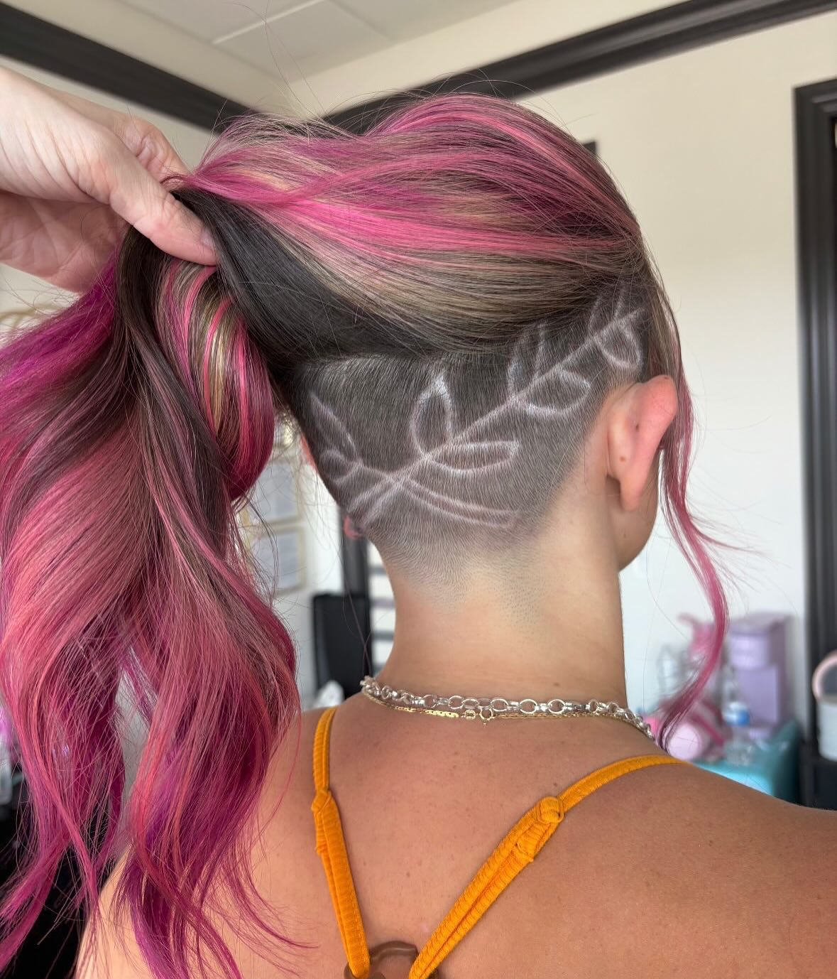 Bold Undercut With Pink Streaks And Leaf Design