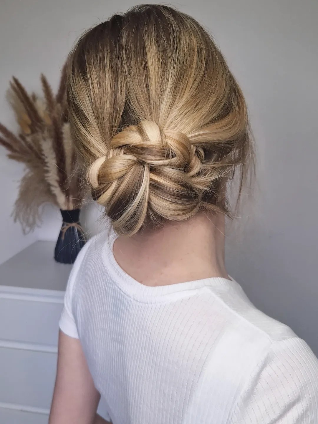 Braided Low Bun With Blonde Highlights