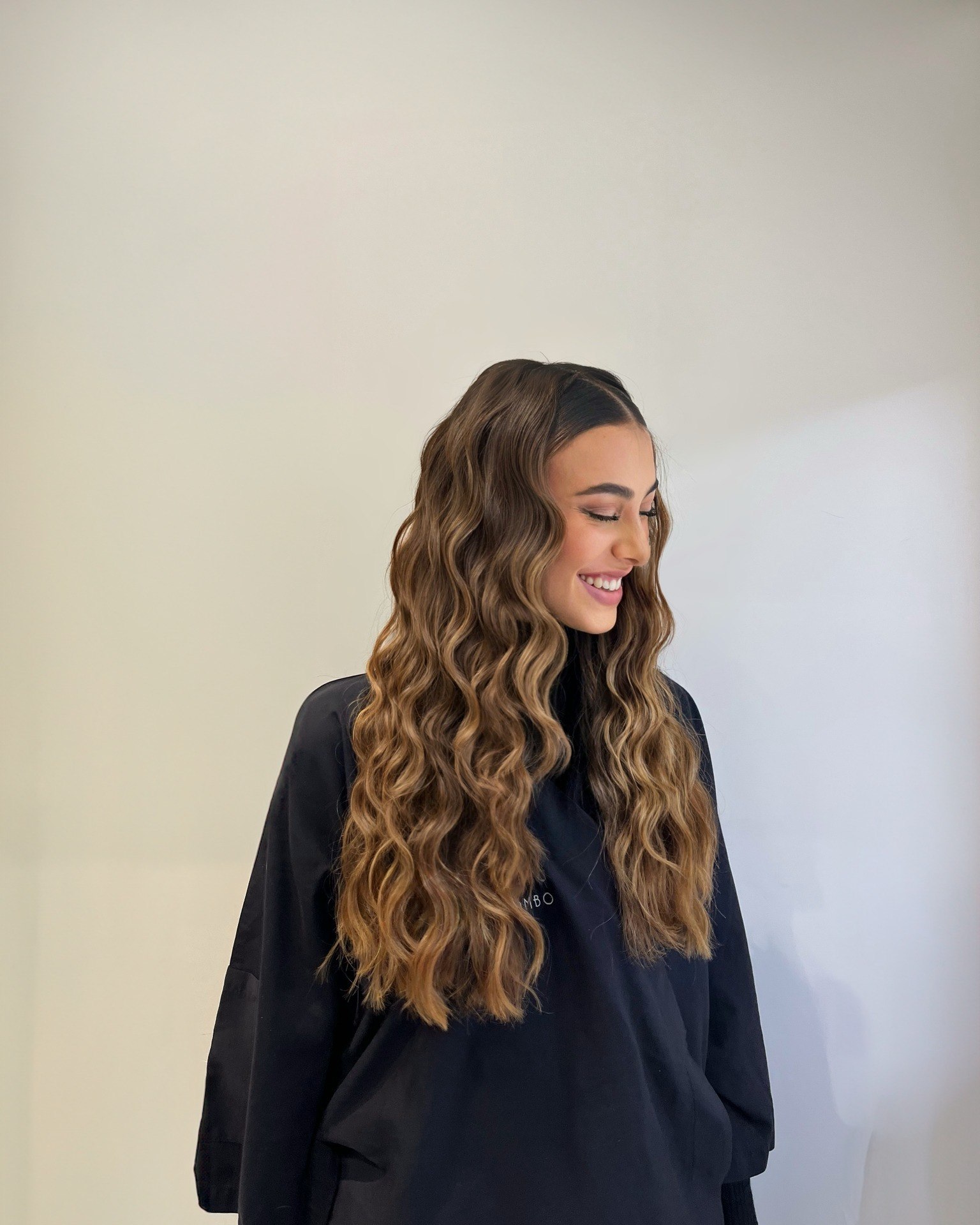 Cascading Deep Barrel Waves With Honey Blonde Balayage