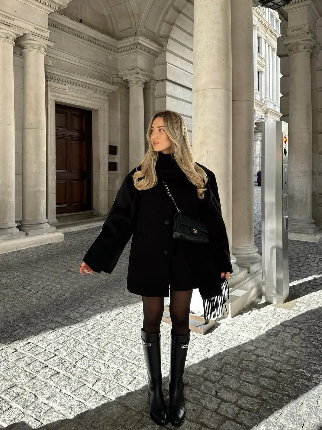 Chic Black Mini Skirt Look With Knee-High Boots