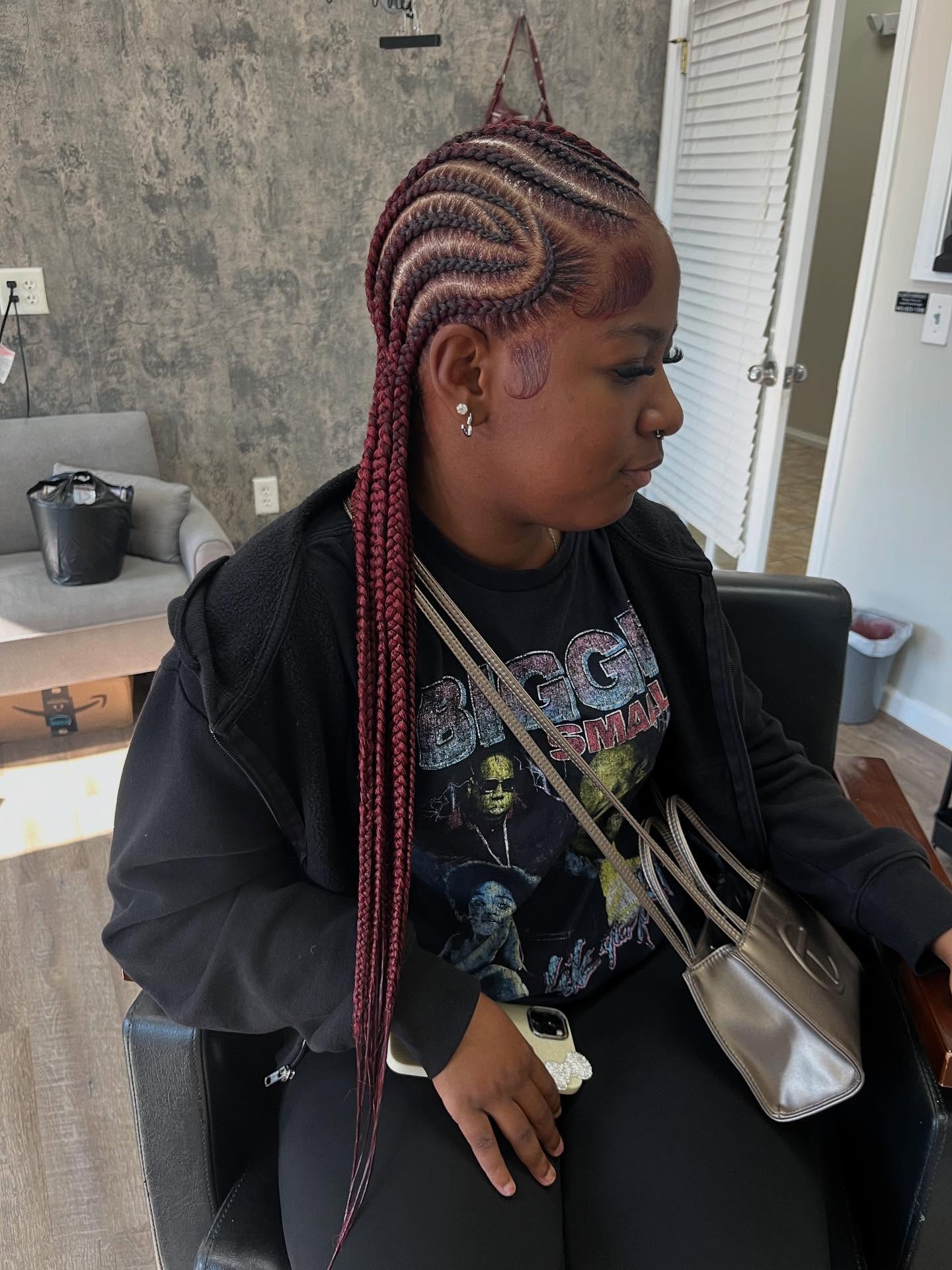 Chic Burgundy Cornrow Braids With Curved Parting