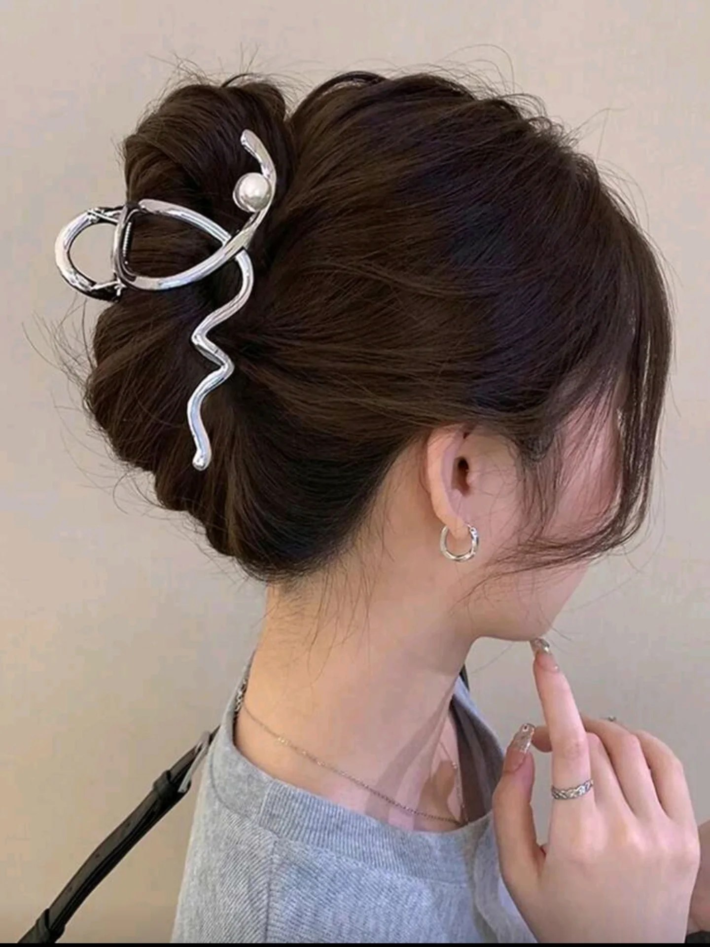 Chic Claw Clip Updo With Subtle Face Framing