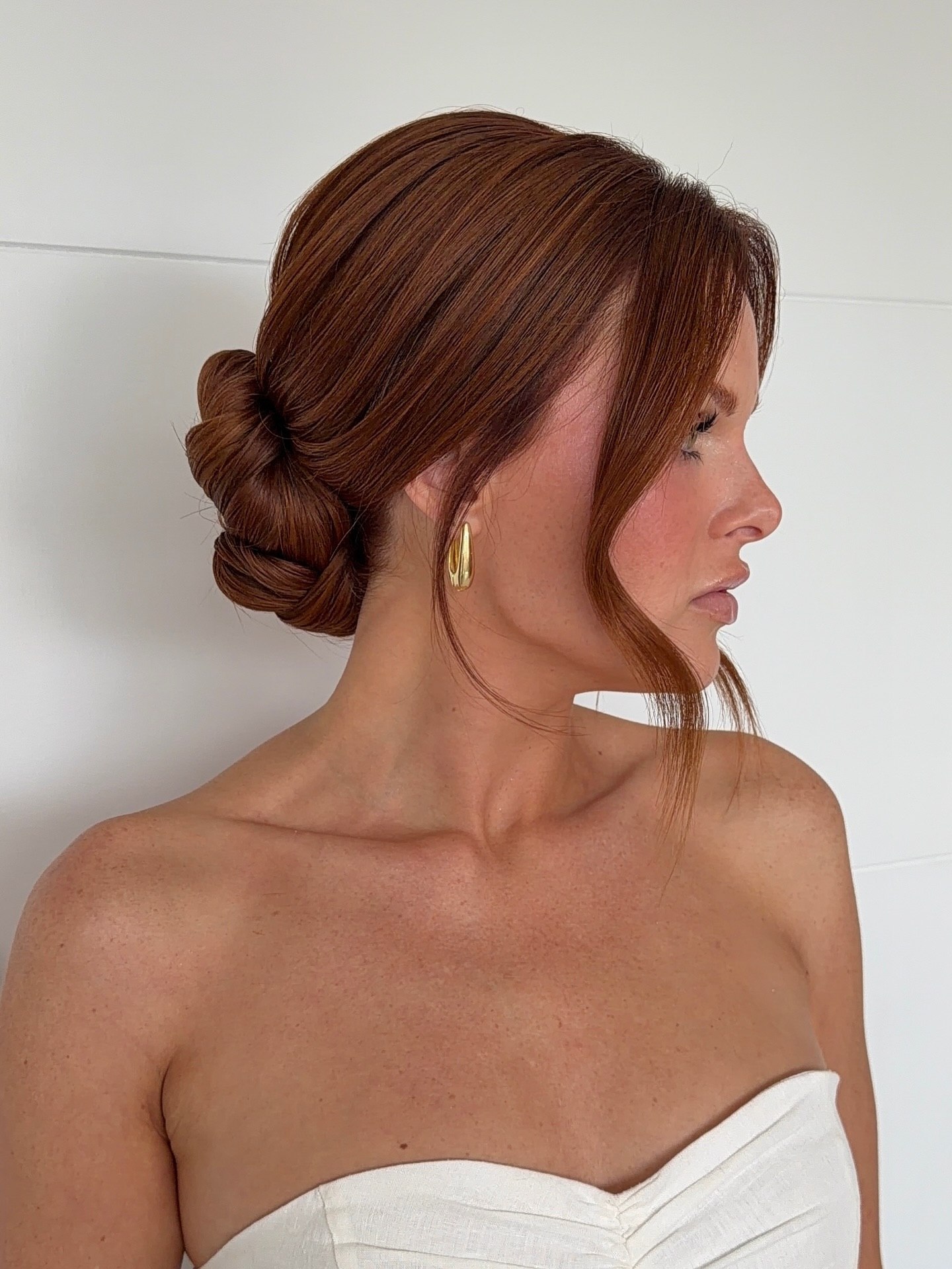 Chic Twisted Low Bun With Face Framing Strands