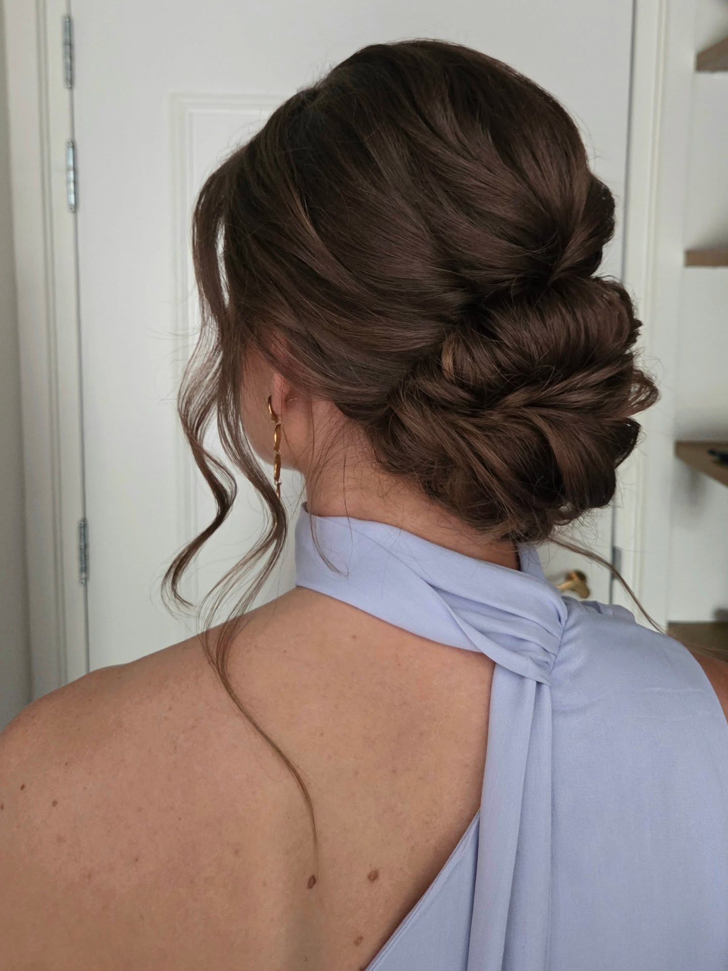 Chic Twisted Low Bun With Face-Framing Tendrils