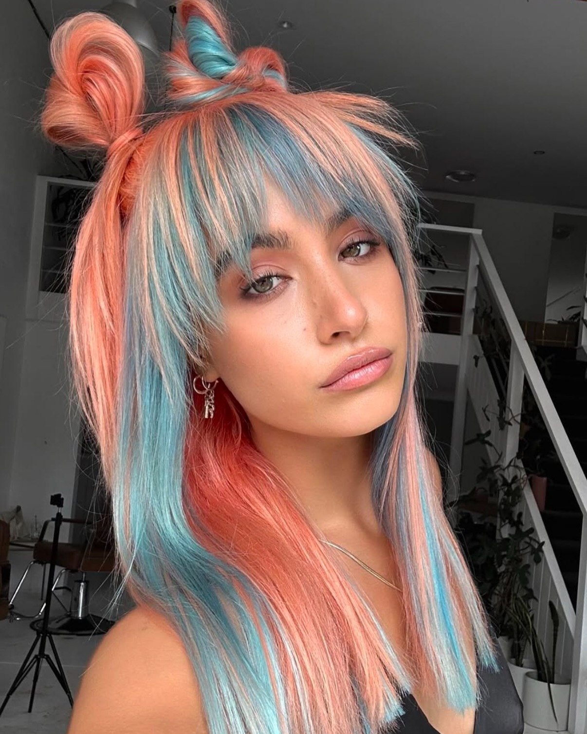 Coral And Teal Two-Tone Hair With Space Buns