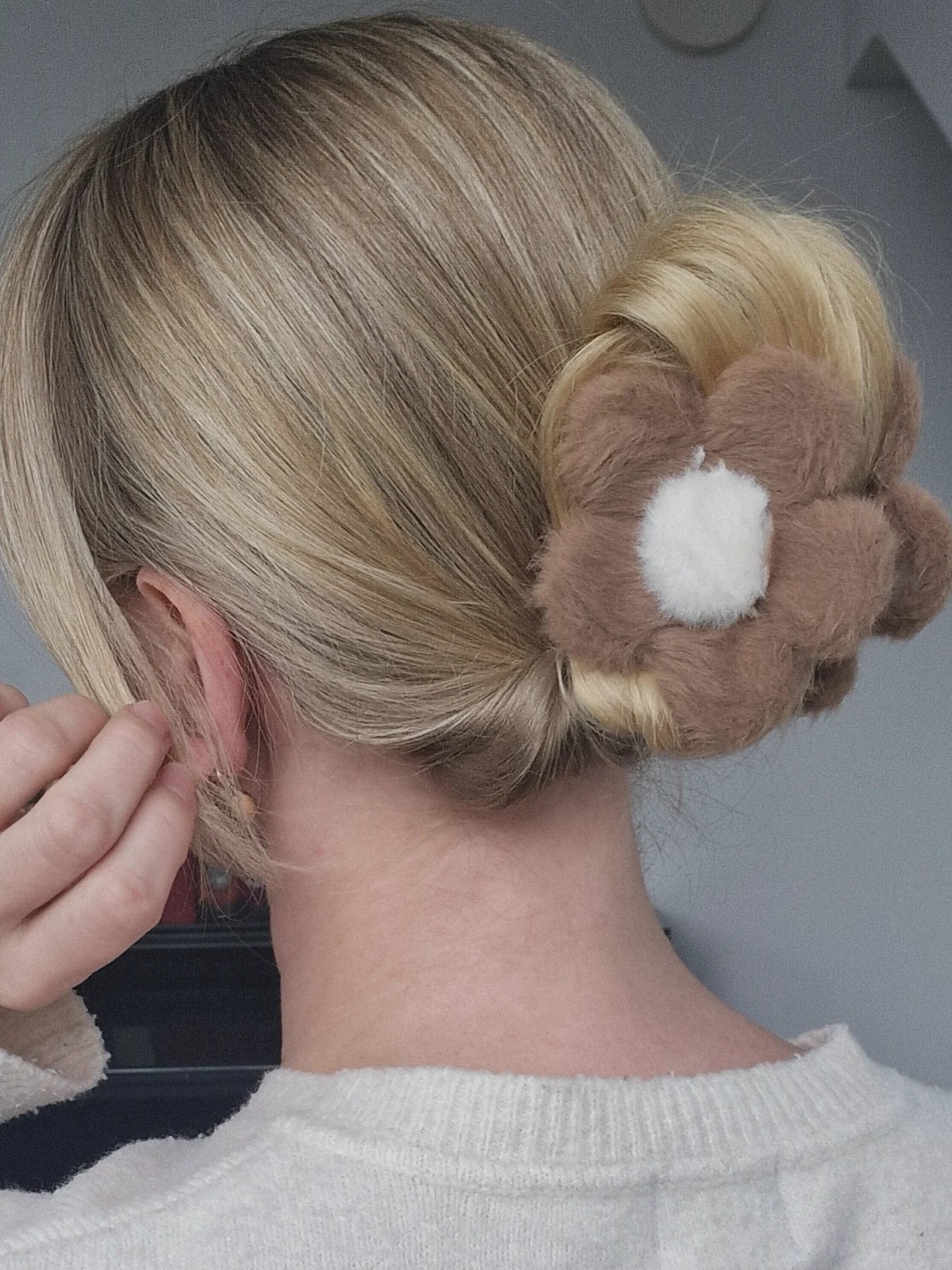 Cozy Chic Bun With Playful Flower Clip