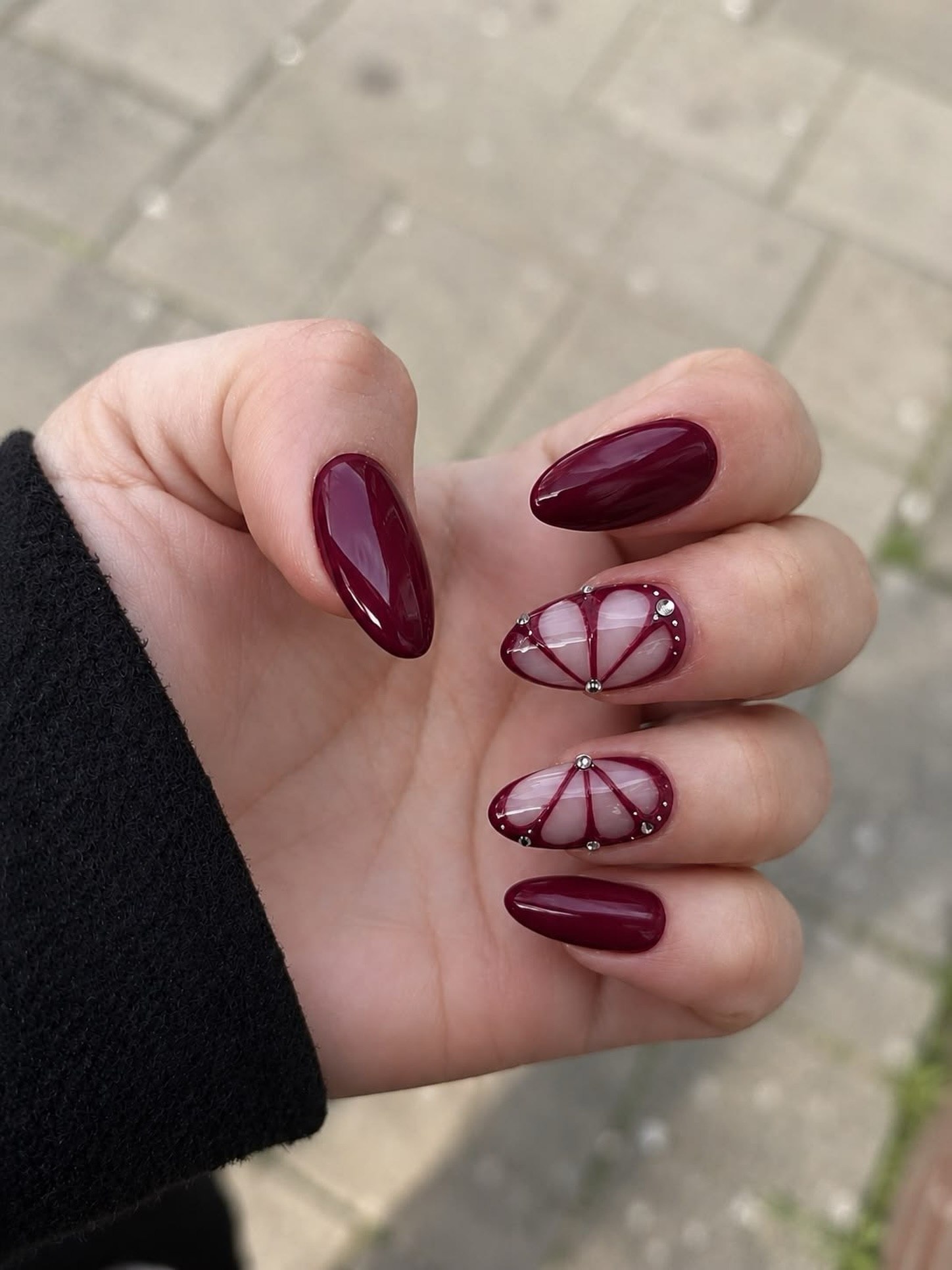 Deep Burgundy Oval Nails with Silver Rhinestone Art